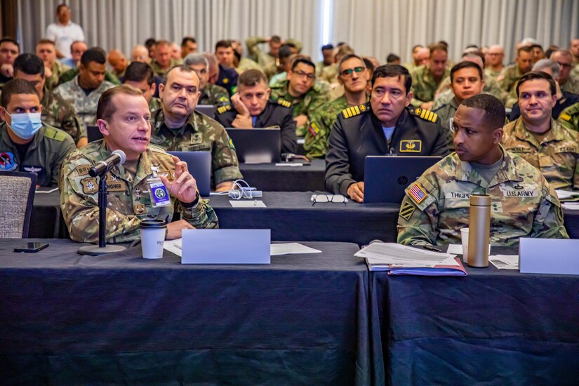 Chilean army Maj. Gen. Ricardo Stangher (left), deputy commanding general of multnational forces for PANAMAX 2022 and U.S. Army Maj. Gen. William Thigpen (right), commanding general of multinational forces for PANAMAX 2022, along with Soldiers, airmen, sailors, marines and civilians from seven Caribbean and South American nations and the U.S. attend a PANAMAX 2022 Planning in Crisis briefing in San Antonio, Texas, June 9, 2022. PANAMAX 2022 is a U.S. Southern Command-sponsored, multinational annual exercise scheduled for 1-12 August, 2022 with a purpose of strengthening partnerships, enhancing readiness and improving interoperability between U.S. Armed Forces and partner nations. This planning event served as an opportunity to build upon the combined capabilities of planning and executing complex operations during the upcoming exercise. (U.S. Army photo by Spc. Joshua Taeckens)