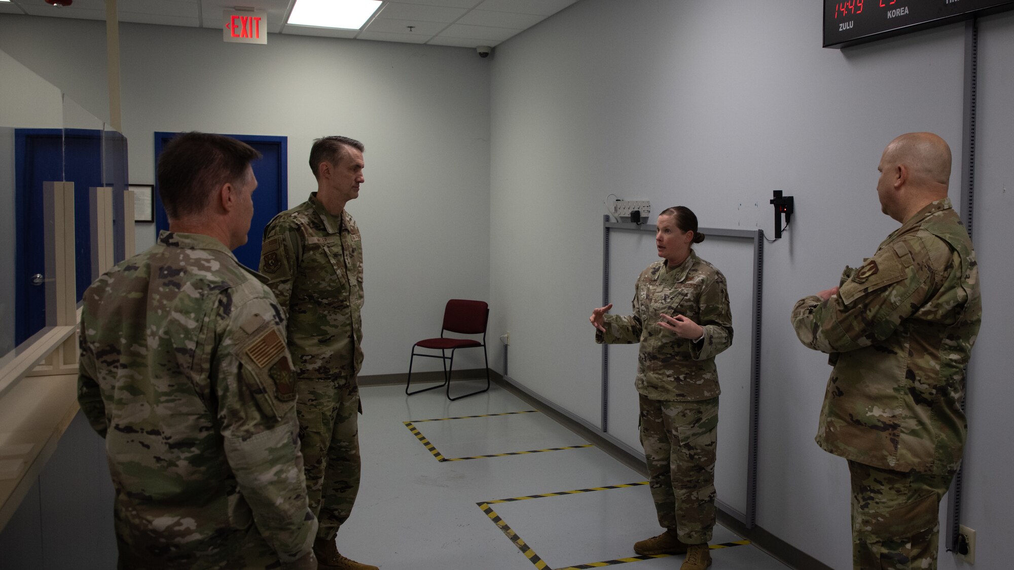 Airman briefing three Airmen