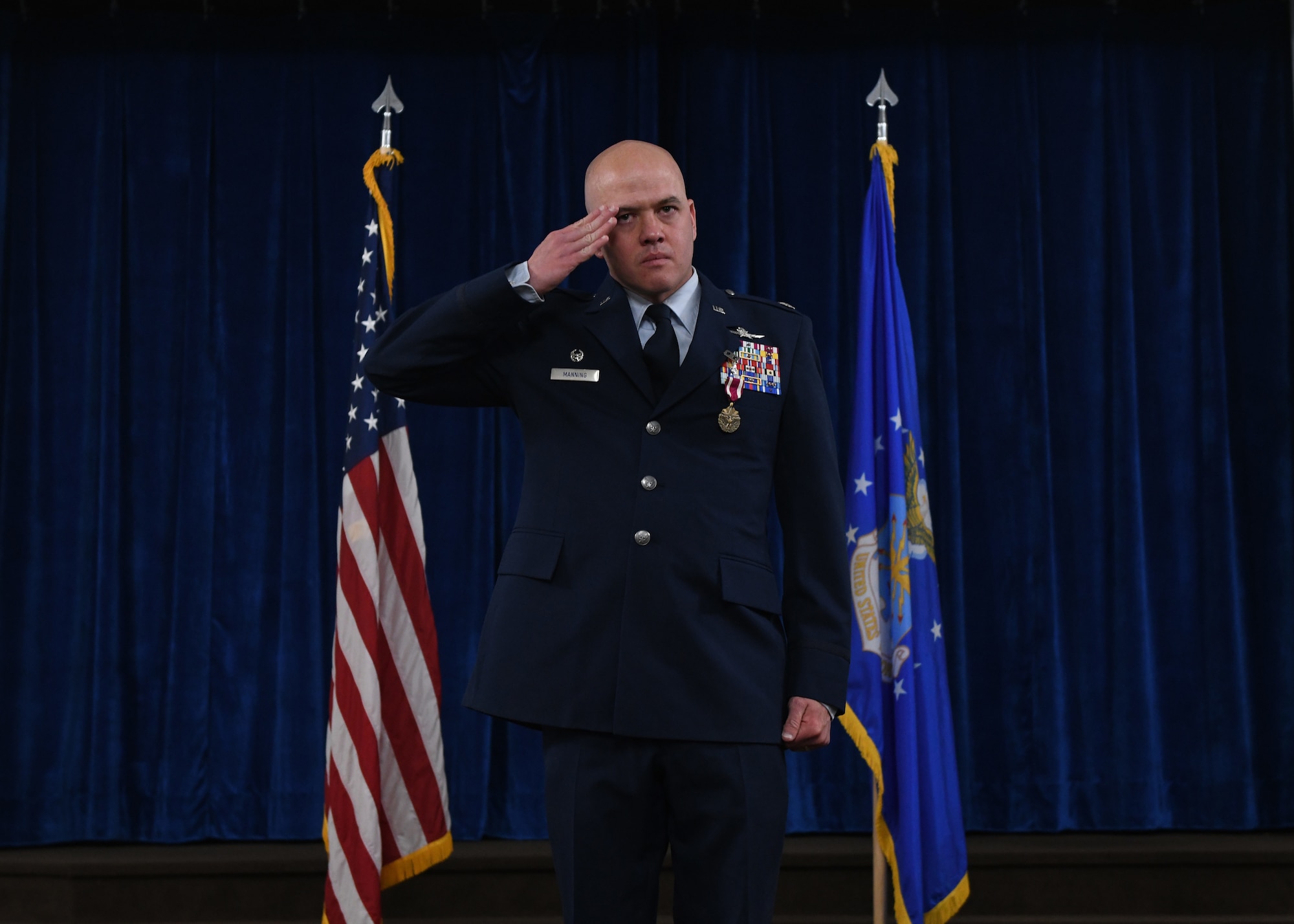 Lt. Col. Joseph Manning, the outgoing commander of the 90th Communication Squadron, renders his final salute to the members of 90 CS during a change of command ceremony on F.E. Warren Air Force Base, June 13, 2022. The change of command ceremony signifies the transition of command from Manning to Maj. Jeffrey Mickelsen, the incoming commander of 90 CS. (U.S. Air Force photo by Airman 1st Class Darius Frazier.)