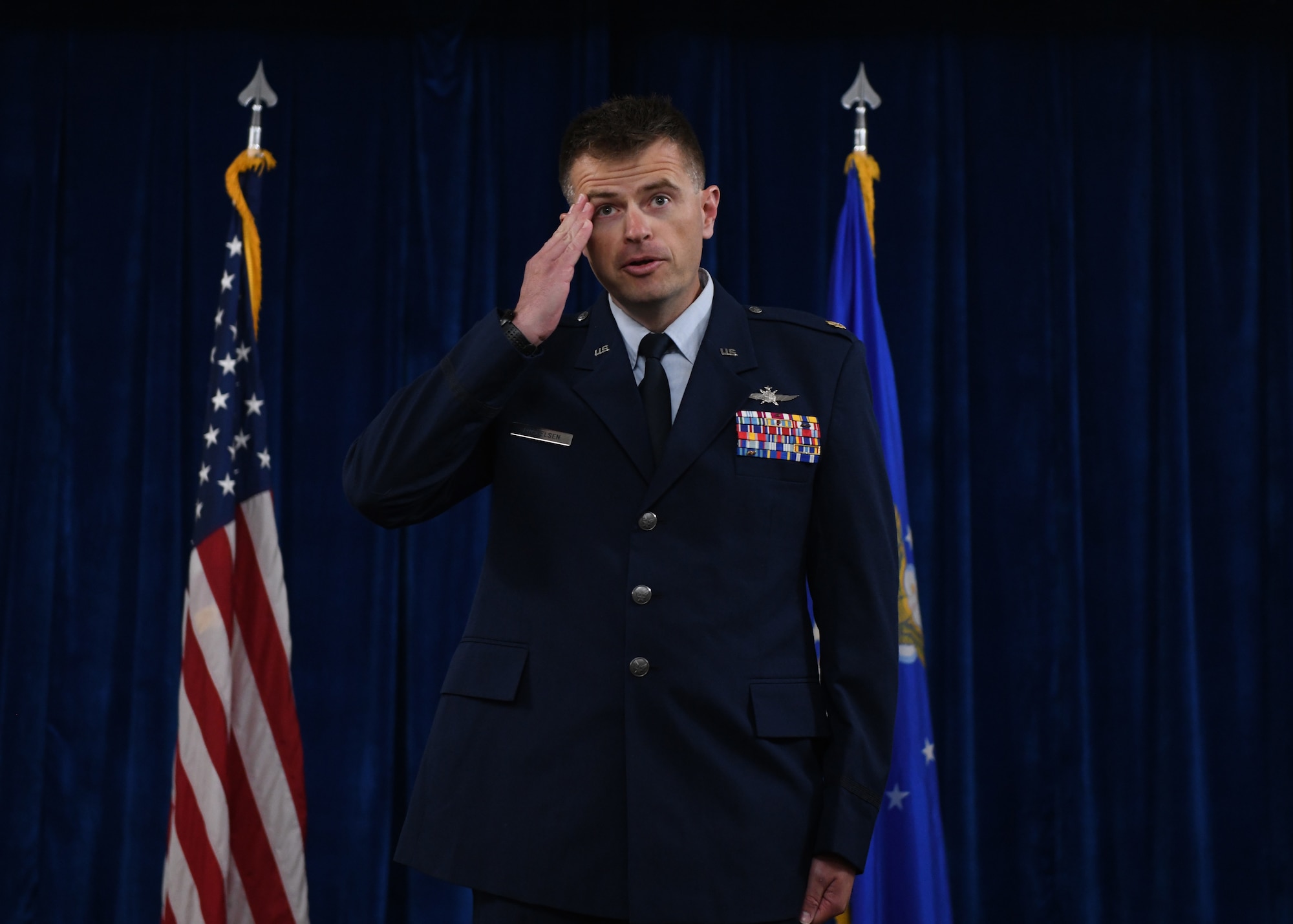 Maj. Jeffrey Mickelsen, the incoming commander of the 90th Communication Squadron, renders his first salute to the members of 90 CS during a change of command ceremony on F.E. Warren Air Force Base, June 13, 2022. The change of command ceremony signifies the transition of command from Lt. Col. Joseph Manning, the outgoing commander of 90 CS, to Mickelsen. (U.S. Air Force photo by Airman 1st Class Darius Frazier.)