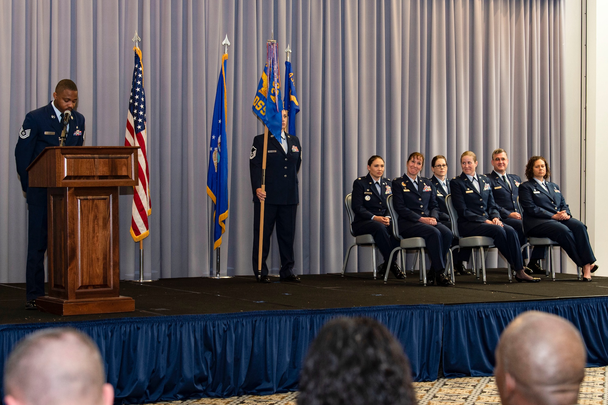 Staff Sgt. Christopher Elam, 436th Operational Medical Readiness Squadron dental records and reception noncommissioned officer in charge, addresses Team Dover Airmen, family members and guests at The Landings on Dover Air Force Base, Delaware, June 9, 2022. During the event, the 436th Medical Support Squadron held an inactivation ceremony, followed by the 436th Health Care Operations Squadron and 436th Operational Medical Readiness Squadron Change of Command ceremonies. The change of command ceremony for the 436th Medical Group culminated the event. (U.S. Air Force photo by Roland Balik)