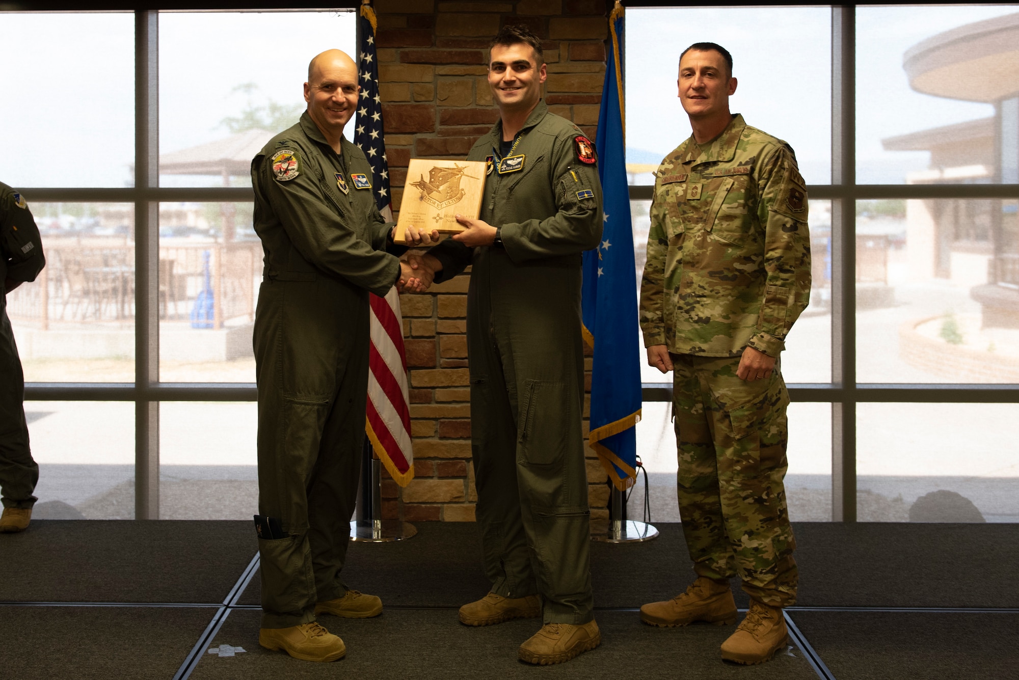 Maj. Michael Karnes, from the 311th Fighter Squadron, accepts the Company Grade Officer of the Quarter Award during the 49th Wing’s 1st quarter awards ceremony, June 10, 2022, on Holloman Air Force Base, New Mexico.