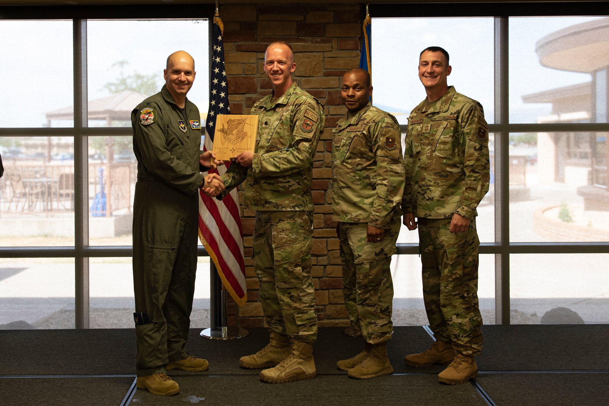 Representatives from 49th Communications Squadron accept the Small Unit of the Quarter Award during the 49th Wing’s 1st quarter awards ceremony, June 10, 2022, on Holloman Air Force Base, New Mexico.