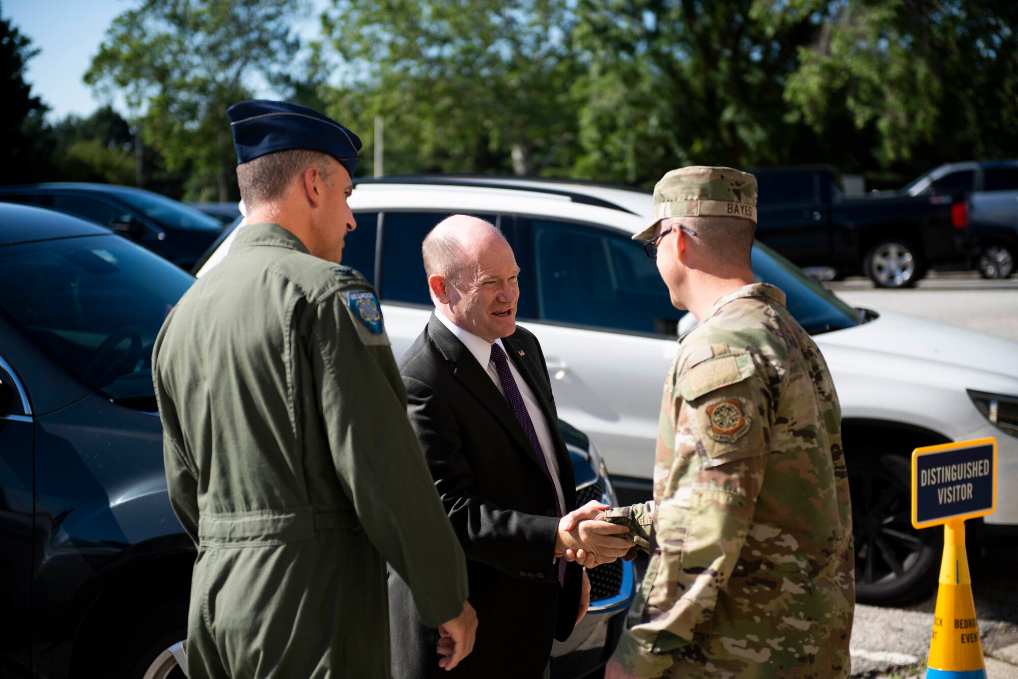 Col. Matt Husemann, left, 436th Airlift Wing commander, and Chief Master Sgt. Timothy Bayes, right, 436th AW command chief, greet U.S. Sen. Chris Coons, center, at Dover Air Force Base, Delaware, June 10, 2022. Coons visited Dover AFB’s SPARK hub, BEDROCK. BEDROCK is Dover’s foundation for innovation, designed to leverage technology and off-the-shelf solutions to fix the military’s problems and bridge the gap between Dover's Airmen and industry experts.(U.S. Air Force photo by Tech. Sgt. J.D. Strong II)