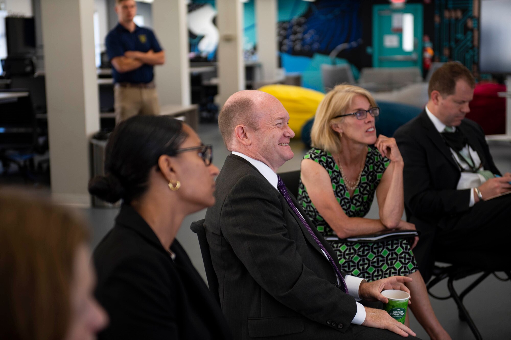 U.S. Sen. Chris Coons, smiles during a brief at Dover Air Force Base, Delaware, June 10, 2022. Coons visited Dover AFB’s SPARK hub, BEDROCK. BEDROCK is Dover’s foundation for innovation, designed to leverage technology and off-the-shelf solutions to fix the military’s problems and bridge the gap between Dover's Airmen and industry experts. (U.S. Air Force photo by Tech. Sgt. J.D. Strong II)
