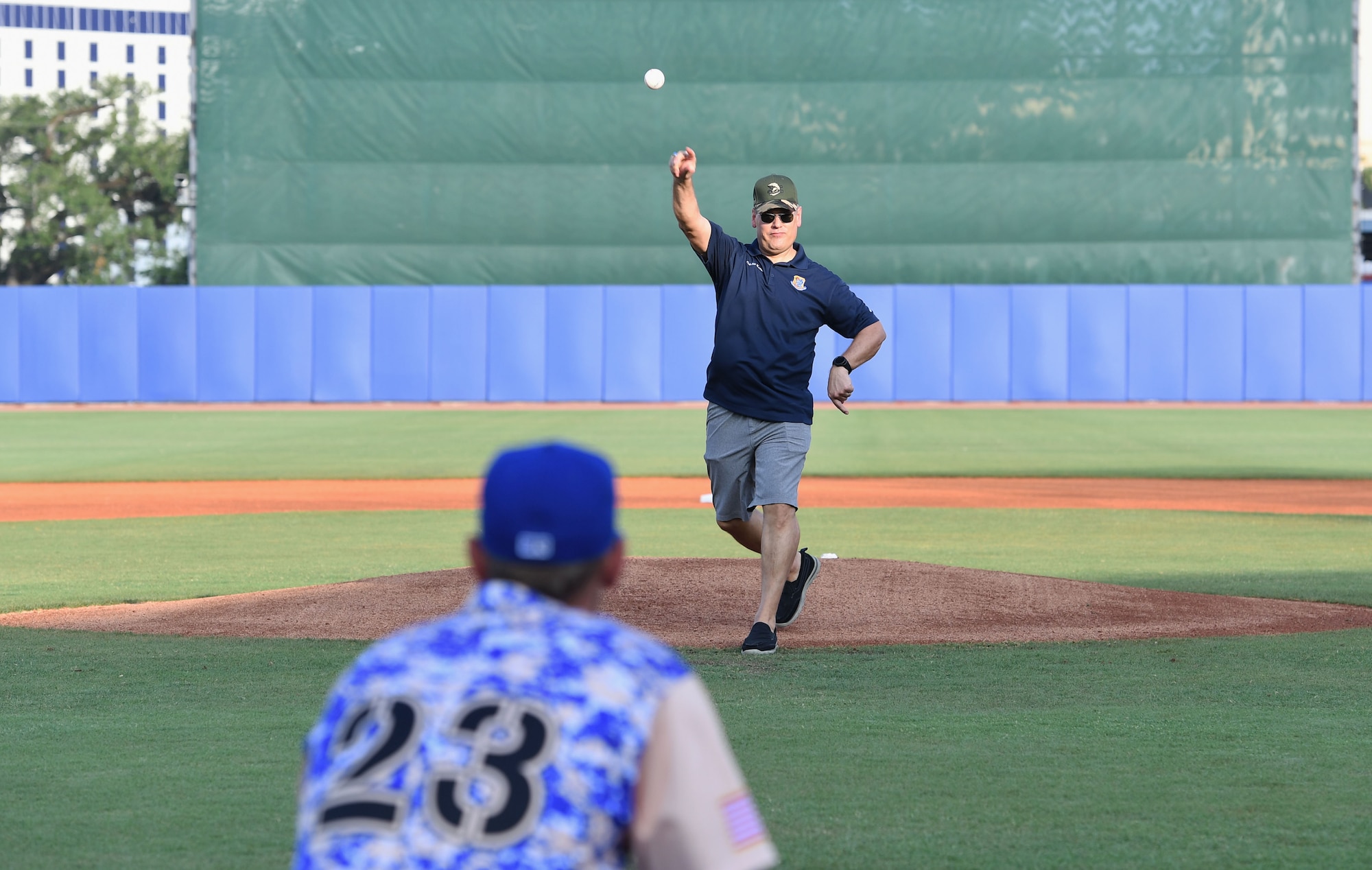 U.S. Air Force Col. James Kafer, 81st Training Wing vice commander, throws a ceremonial first pitch during the Biloxi Shuckers Minor League Baseball game in Biloxi, Mississippi, June 11, 2022. The Shuckers hosted a military appreciation night where service members received free tickets. (U.S. Air Force photo by Kemberly Groue)