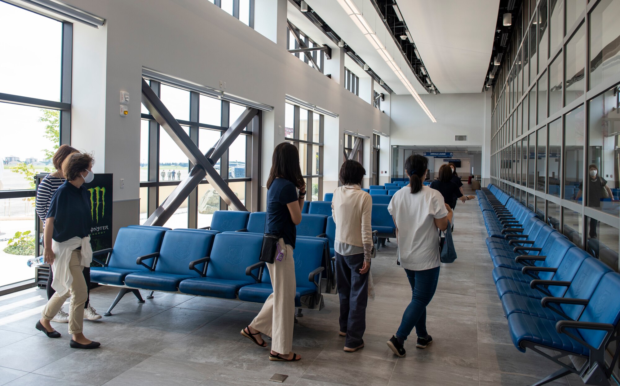 Attendees explore the Yokota Passenger Terminal after a ribbon cutting ceremony, June 13, 2022, at Yokota Air Base, Japan. The project spanned nearly seven years, with planning starting in late 2015, construction starting in June of 2020 and completion in June of 2022.