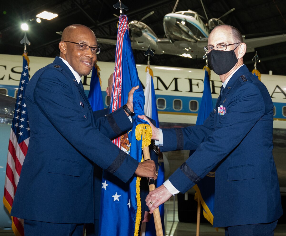 military members passing flag photo