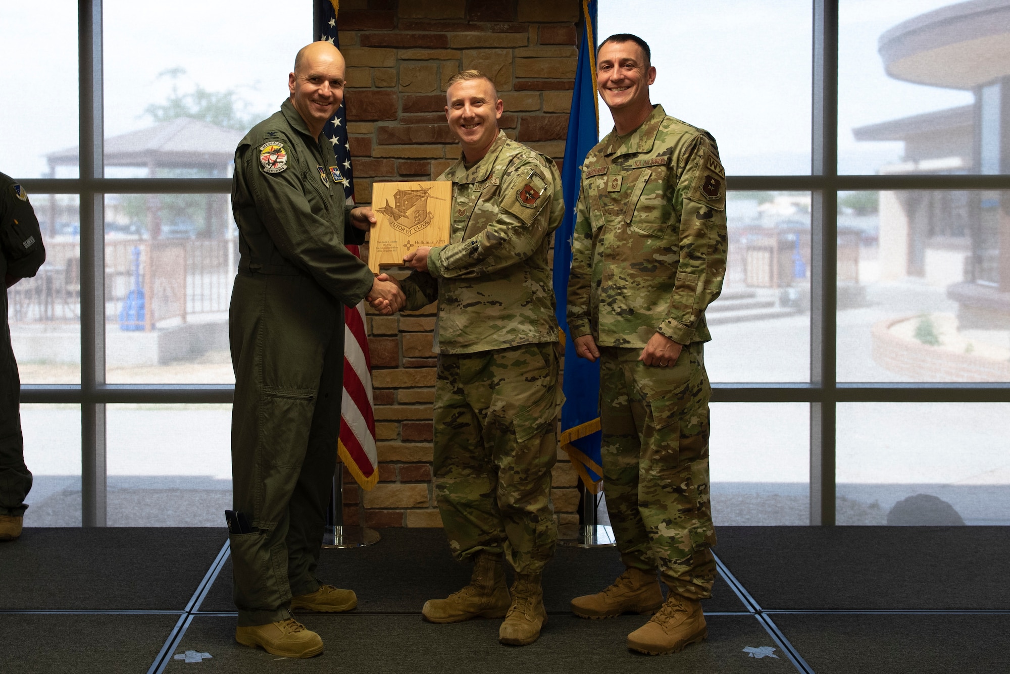 Tech Sgt. Austin Coleman, from the 49th Force Support Squadron, accepts the Noncommissioned Officer of the Quarter Award during the 49th Wing’s 1st quarter awards ceremony, June 10, 2022, on Holloman Air Force Base, New Mexico.