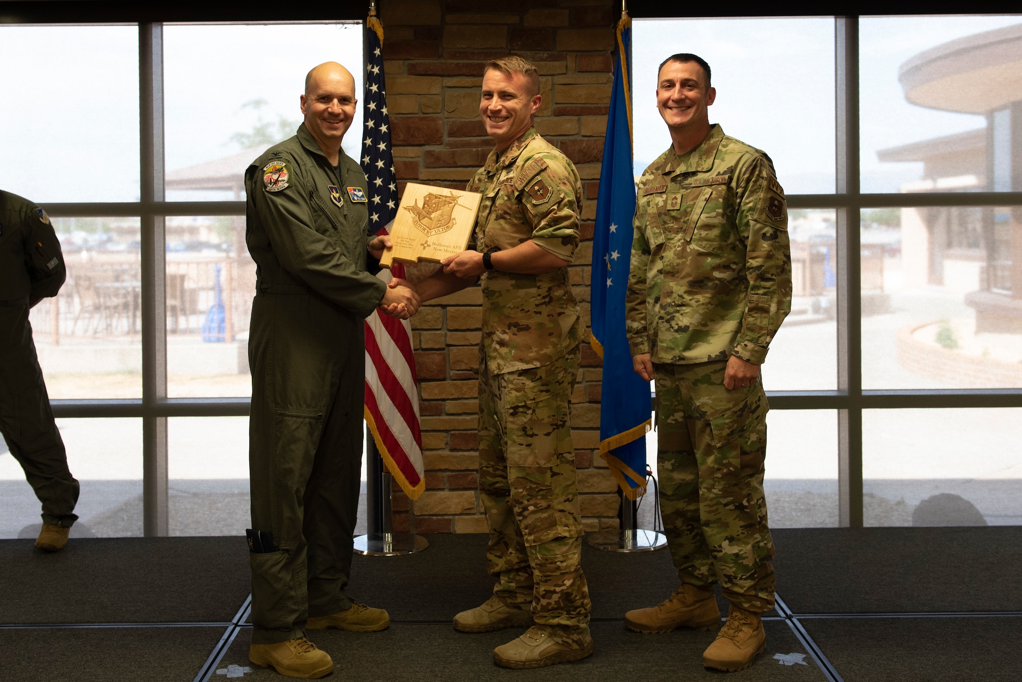 Capt. Travis Morgan, from the 9th Attack Squadron, accepts the Company Grade Officer of the Quarter Award during the 49th Wing’s 1st quarter awards ceremony, June 10, 2022, on Holloman Air Force Base, New Mexico.