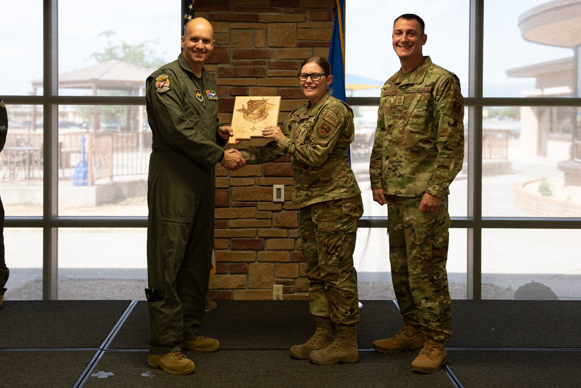 Senior Airman Emily Shrader, from the 49th Equipment Maintenance Squadron, accepts the Honor Guardsman of the Quarter Award during the 49th Wing’s 1st quarter awards ceremony, June 10, 2022, on Holloman Air Force Base, New Mexico.