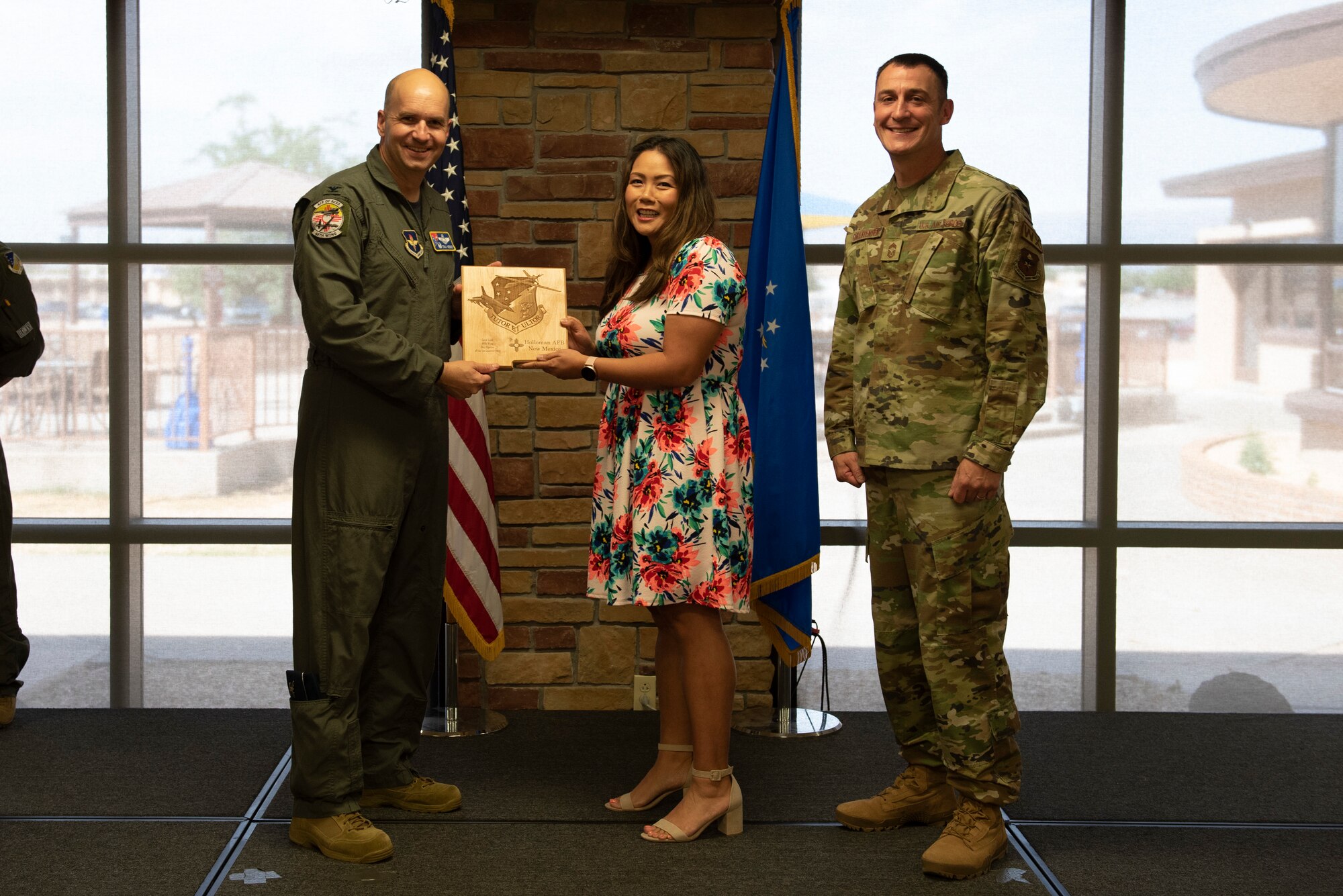Mrs. Lora Braxton, 49th Operations Group key spouse, accepts the Key Spouse of the Quarter Award during the 49th Wing’s 1st quarter awards ceremony, June 10, 2022, on Holloman Air Force Base, New Mexico.