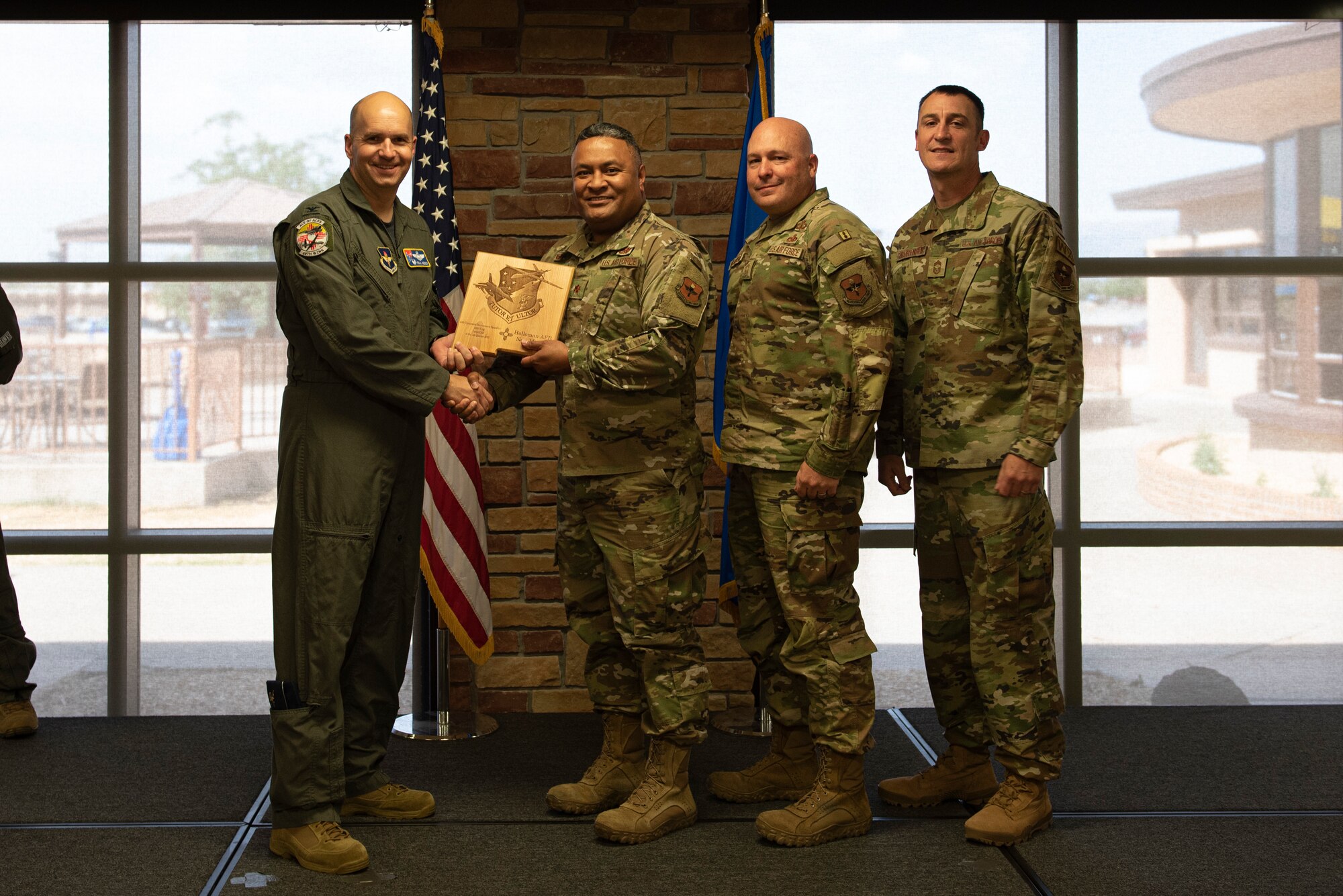 Representatives from 49th Equipment Maintenance Squadron accept the Large Unit of the Quarter Award during the 49th Wing’s 1st quarter awards ceremony, June 10, 2022, on Holloman Air Force Base, New Mexico.