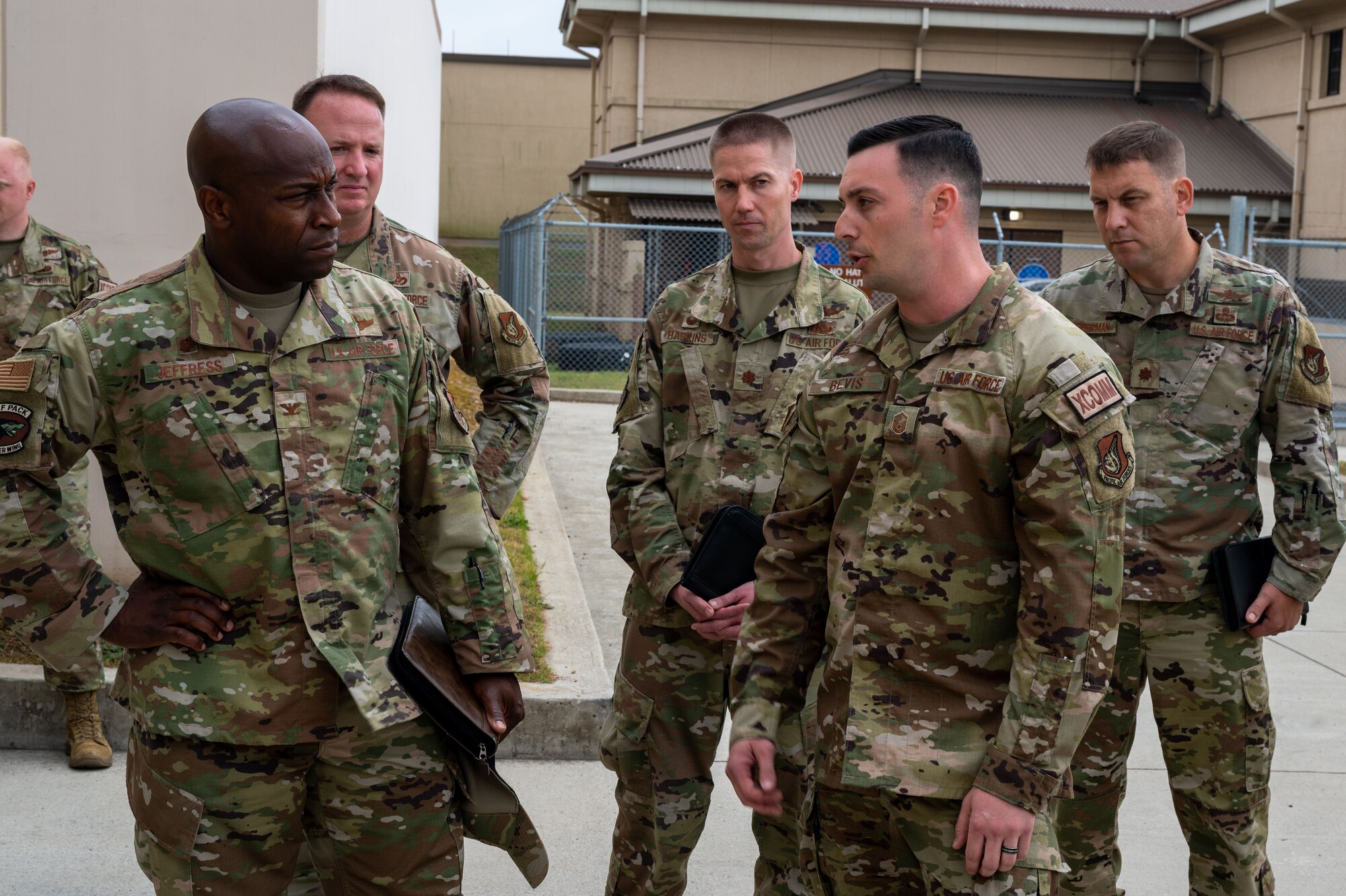 Master Sgt. Byron Bevis, 8th Communications Squadron plans and resources flight chief, briefs Col. Henry R. Jeffress III, 8th Fighter Wing (FW) commander and Chief Master Sgt. Carlos F. Damian, 8th FW command chief, on the capabilities of the base Wi-Fi project at Kunsan Air Base, Republic of Korea, June 6, 2022. The former 8th Fighter Wing commander, Col. John B. Gallemore, initiated the project and Col. Jeffress strives to see through to completion. (U.S. Air Force Photo by Senior Airman Akeem K. Campbell)