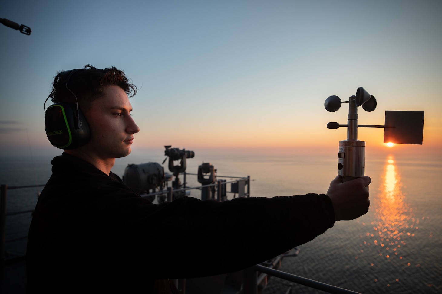 U.S. Navy Aerographer’s Mate Airman Chase Dublin uses a handheld anemometer to gather wind speed and weather information aboard the Wasp-class amphibious assault ship USS Kearsarge (LHD 3) during exercise BALTOPS 22, June 10, 2022.