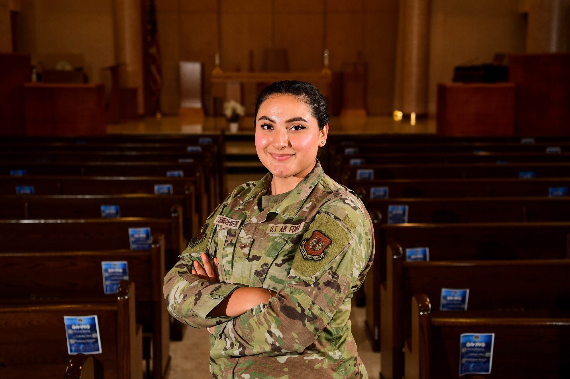Senior Airman Nicolle Schambon Martinez, 31st Fighter Wing religious affairs journeyman, poses for a photo at Aviano Air Base, Italy, June 13, 2022. Martinez was recently awarded the U.S. Air Forces in Europe and Air Forces Africa Religious Affairs Airman of the Year. (U.S. Air Force photo by Senior Airman Noah Sudolcan)