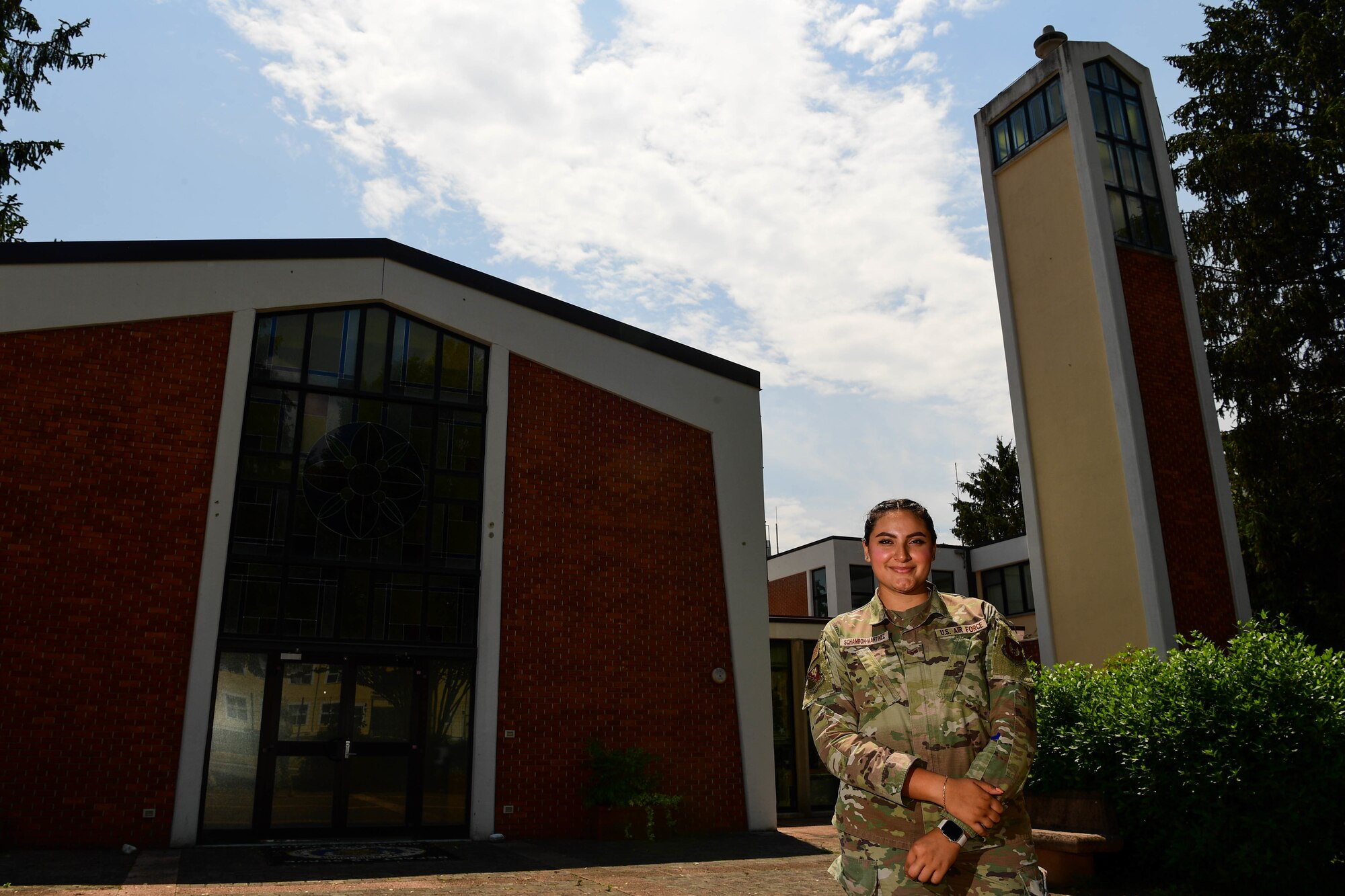 Senior Airman Nicolle Schambon Martinez, 31st Fighter Wing religious affairs journeyman, poses for a photo at Aviano Air Base, Italy, June 13, 2022. Martinez was recently awarded the U.S. Air Forces in Europe and Air Forces Africa Religious Affairs Airman of the Year. (U.S. Air Force photo by Senior Airman Noah Sudolcan)