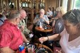 Maj. Gen. Mark Schindler, second from left, adjutant general of Pennsylvania, talks with guests aboard The Pride of the Susquehanna on June 12, 2022. The riverboat, in coordination with Pennsylvania National Guard Survivor Outreach Services, hosted a cruise for Surviving Families.
