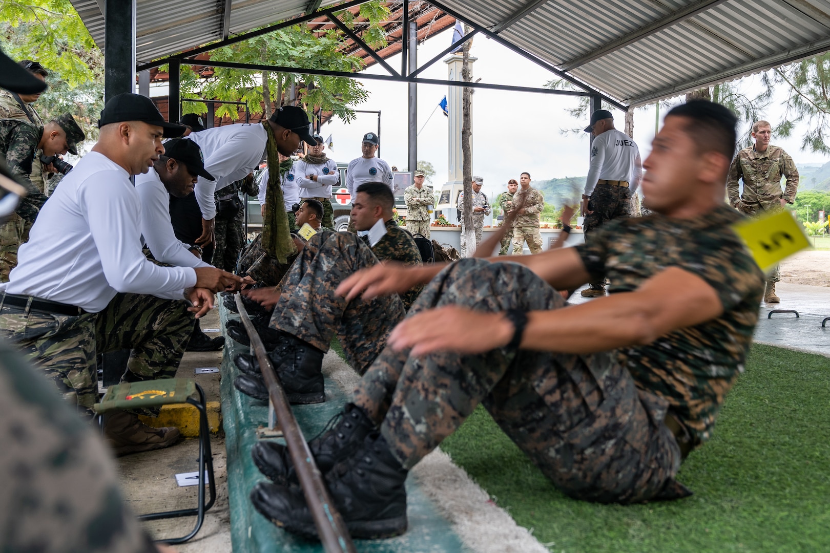 Guatemala team members perform the situp portion of the Physical Training Test as part of the first event for Fuerzas Comando 2022, on June 13, 2022, in Tegucigalpa, Honduras.