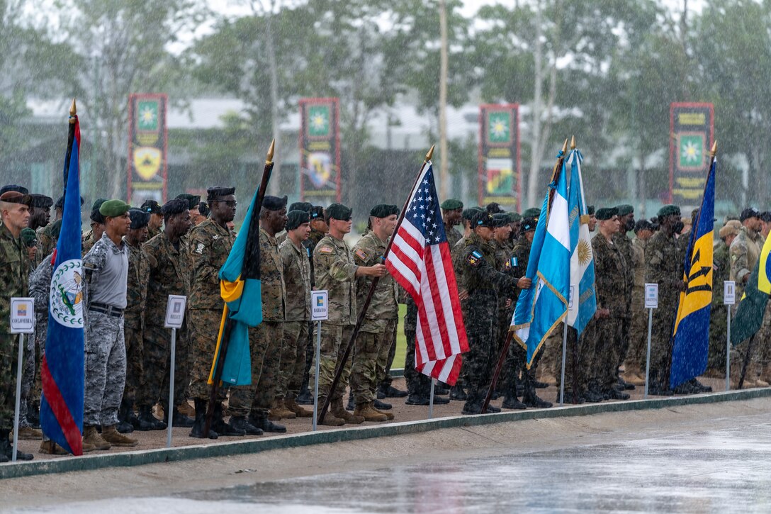 Members taking part in Fuerzas Comando 2022 stand in the rain during the opening ceremony of Fuerzas Comando 2022 on June 13, 2022, in Tegucigalpa, Honduras. Honduras hosts the event from June 13-24.