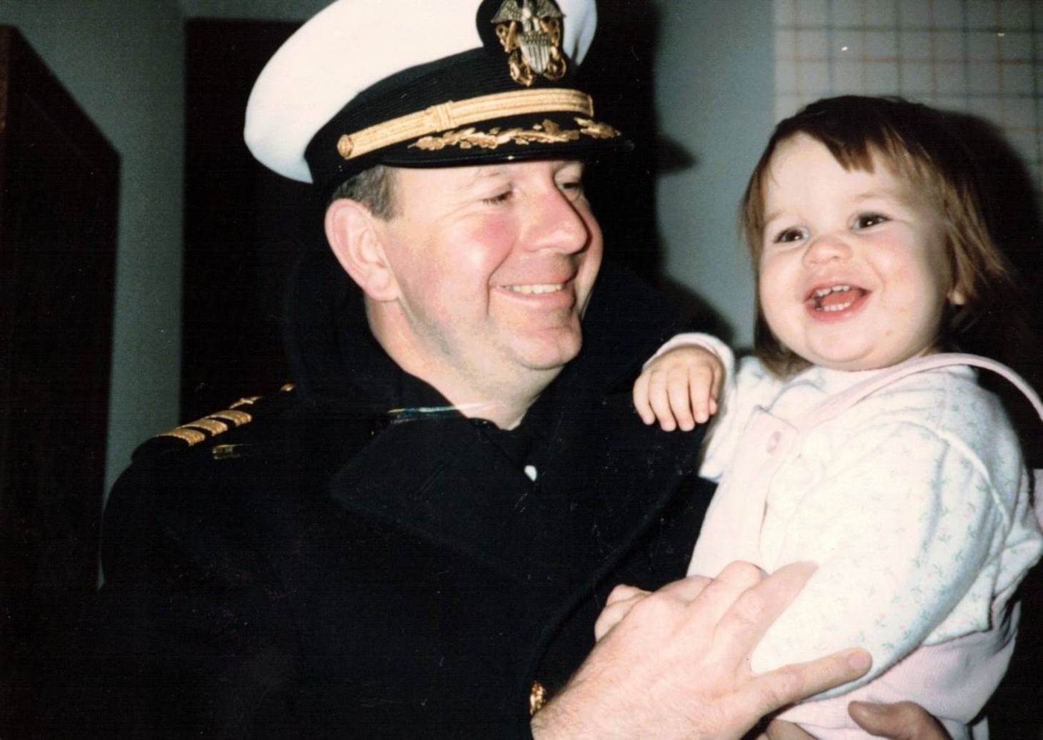Ens. Erin Omberg as a child and her father. (Photo courtesy of Ens. Erin Omburg)