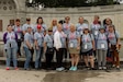 Past and present Kentucky Guard service members pose for a photo outside the National Women's History Museum in Arlington, Virginia June 11, 2022. They represent the guard affiliated Soldiers and Airmen of the 134 female, Kentucky Veterans that were selected for Kentucky’s first all-female Honor Flight.  (U.S. Army Photo by Sgt. Jesse Elbouab)