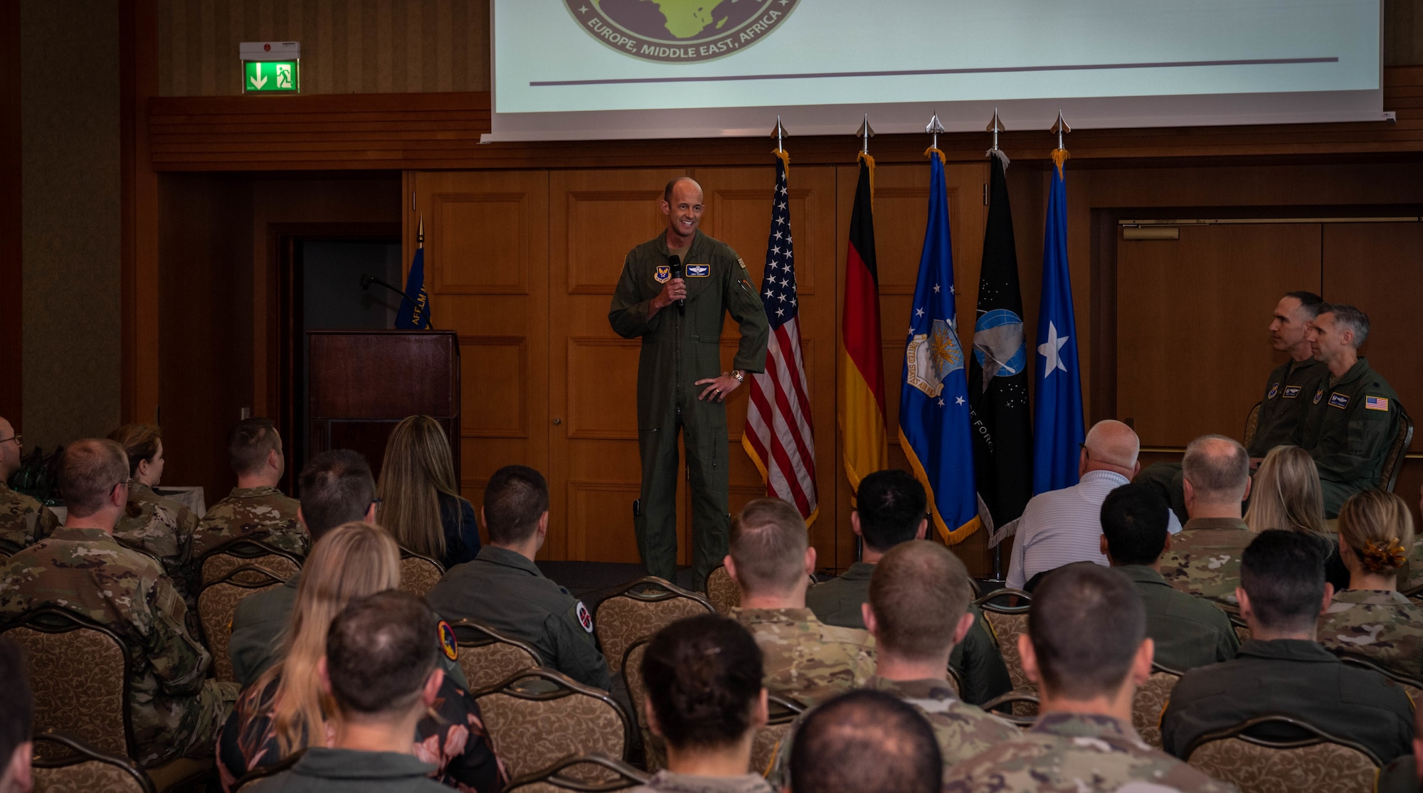 U.S. Air Force Brig. Gen. John Teichert, assistant deputy under Secretary of the Air Force, International Affairs, gives a speech during a Military Personnel Exchange Program change of command ceremony.