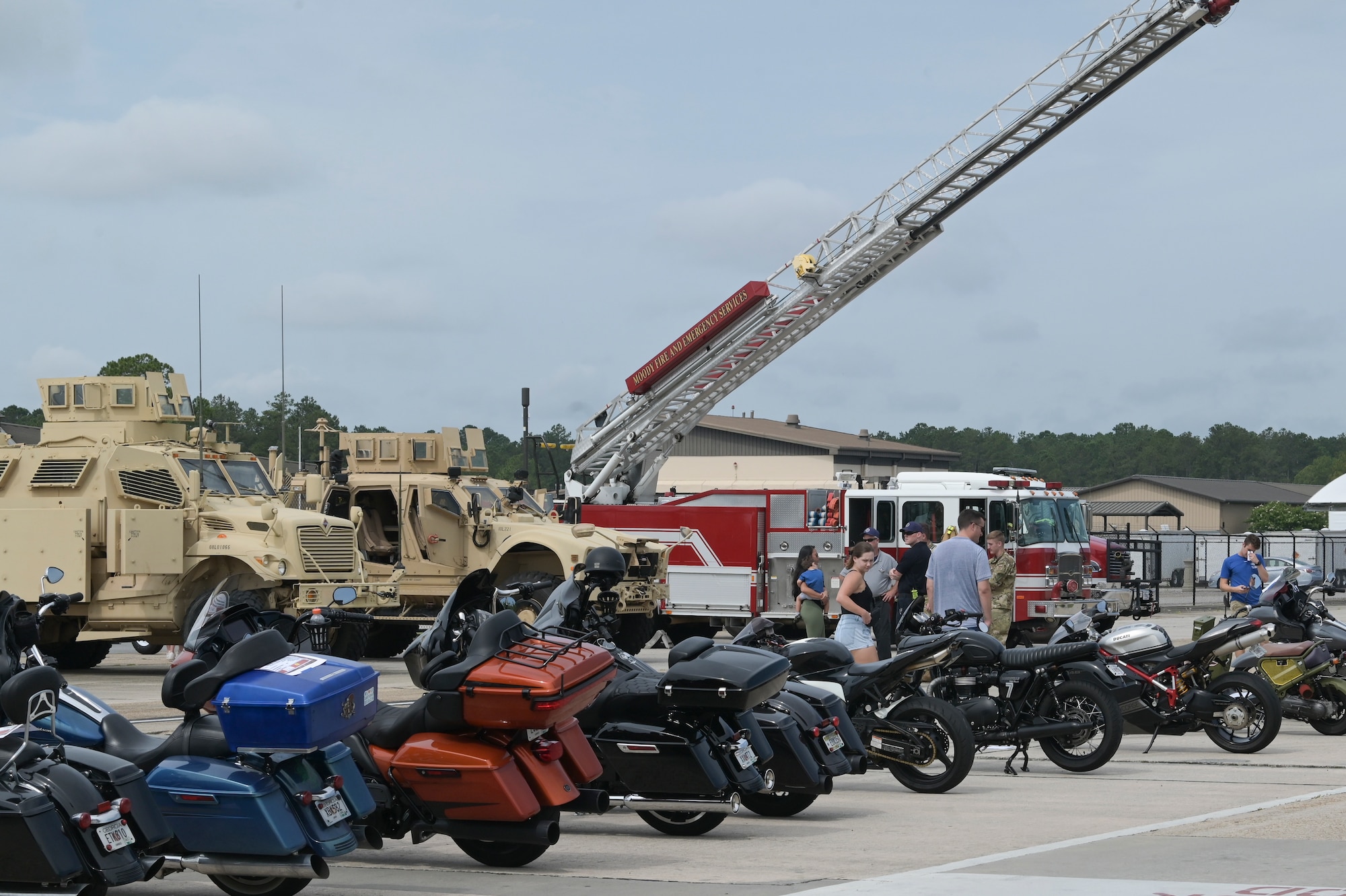 U.S. Air Force Airmen and their families attend a car show at Moody Air Force Base, Georgia, June 11, 2022. Eighty-eight cars, trucks, and motorcycles were displayed for the event where attendees had the opportunity to vote for their favorite vehicle. (U.S. Air Force photo by Senior Airman Rebeckah Medeiros)