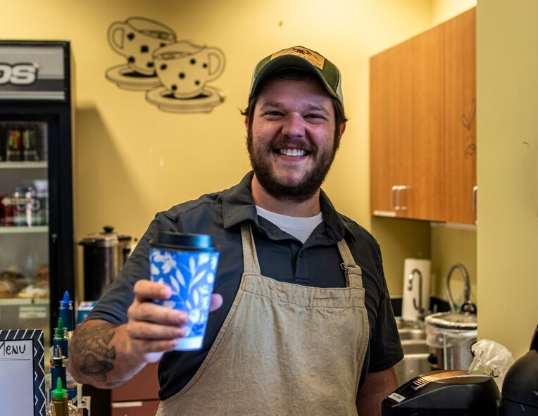 man holding coffee