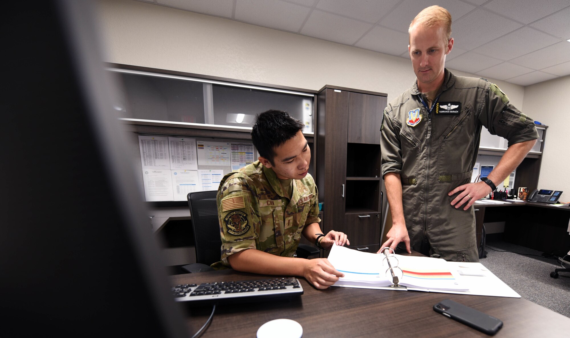 Airmen review the Installation Emergency Management Plan
