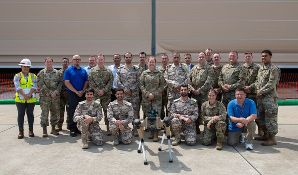 Members of the Qatar Emiri Corps of Engineers, U.S Army, U.S. Air Force and Tyndall Air Force Base rebuild partners pose for a group photo during a distinguished visitors tour at Tyndall Air Force Base, Florida, June 9, 2022. As the “Installation of the Future”, Tyndall hosts tours to share the new technologies and innovations the Air Force is implementing. (U.S. Air Force photo by Airman 1st Class Zachary Nordheim)