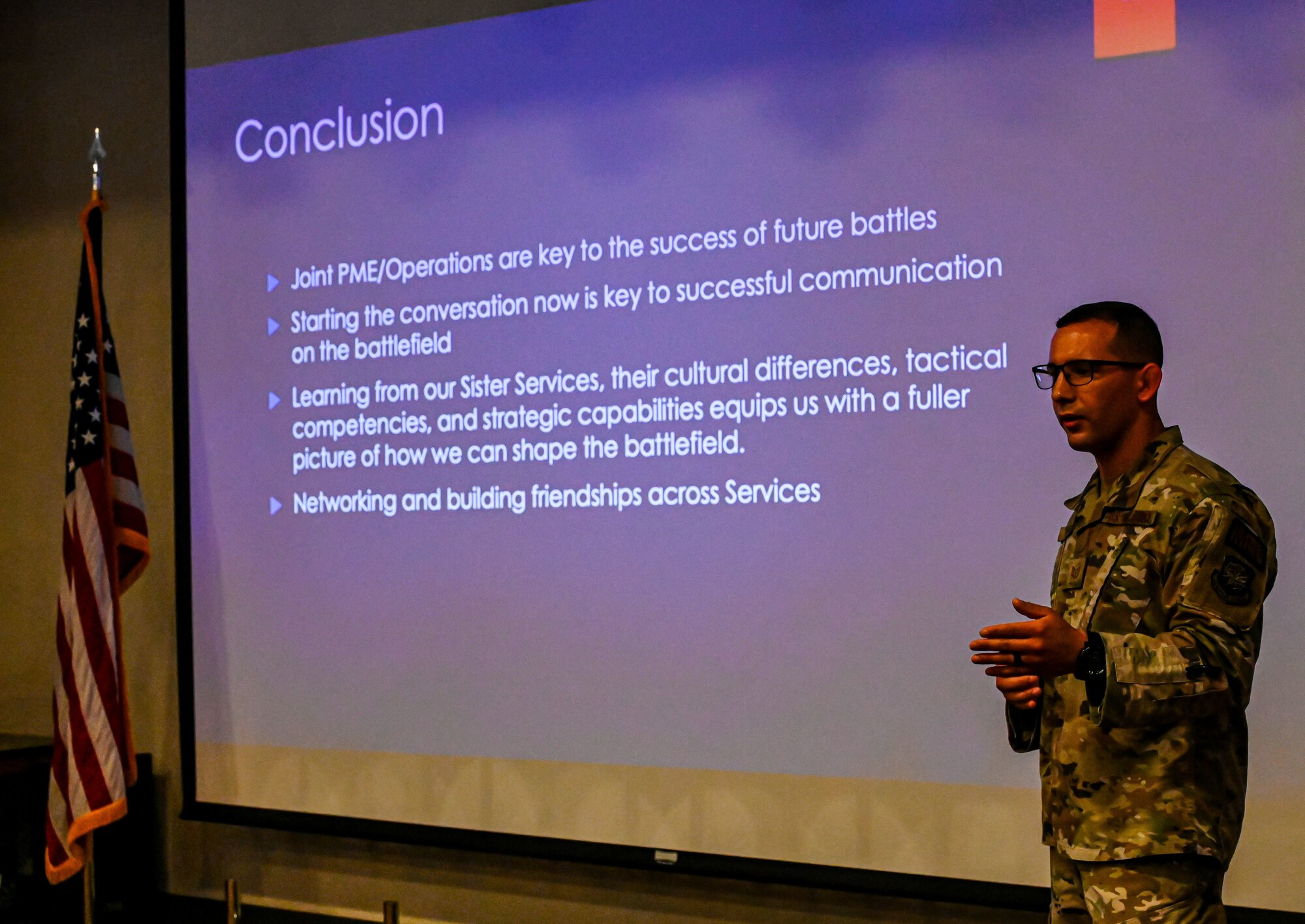 A U.S. Air Force airman addresses the class during the capstone project of the Leading Edge Joint Service Seminar, at Joint Base McGuire-Dix-Lakehurst, June 10, 2022. Members from five different branches attended the weeklong seminar to focus on debunking inter-service cultural myths, talent management, ethical dilemmas, and discussions about our nation’s adversaries. (U.S. Air Force photo by Staff Sergeant Sabatino DiMascio)