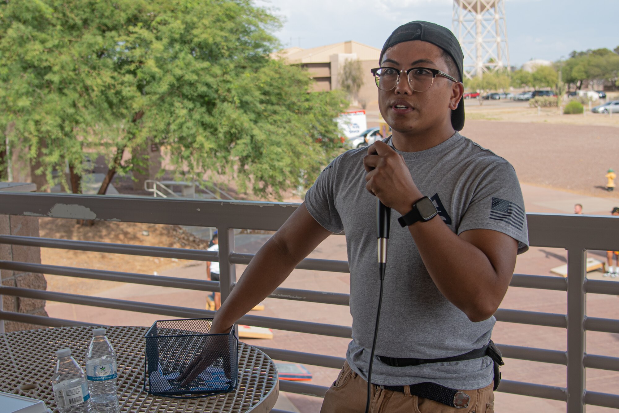 A photo of someone holding a microphone.