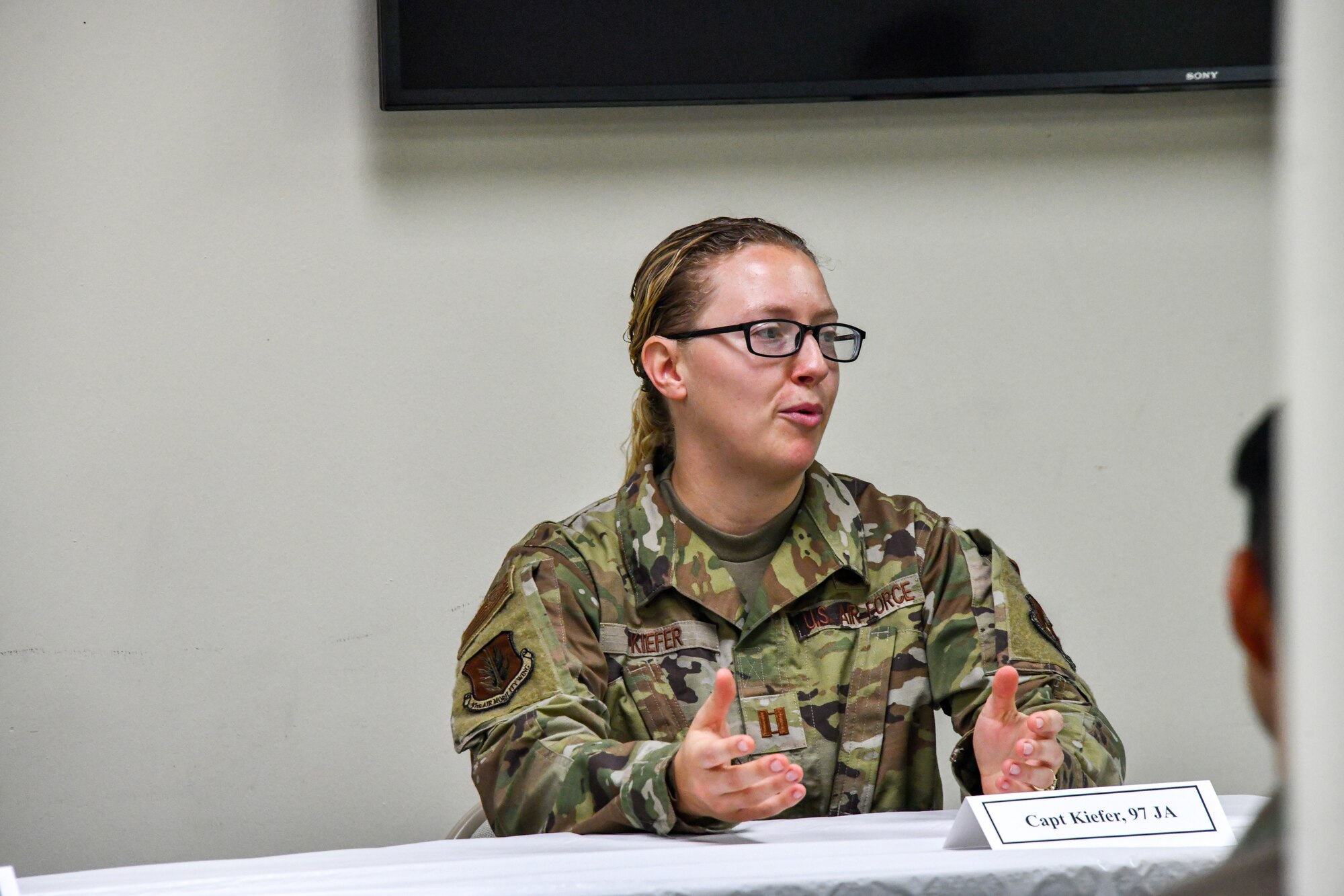 U.S. Air Force Captain Sarah Kiefer, 97th Air Mobility Wing assistant staff judge advocate, answers a question during an LGBTQ+ discussion panel at Altus Air Force Base, Oklahoma, June 10, 2022. The panel consisted of members from different squadrons across the base to offer different perspectives. (U.S. Air Force photo by Airman 1st Class Miyah Gray)