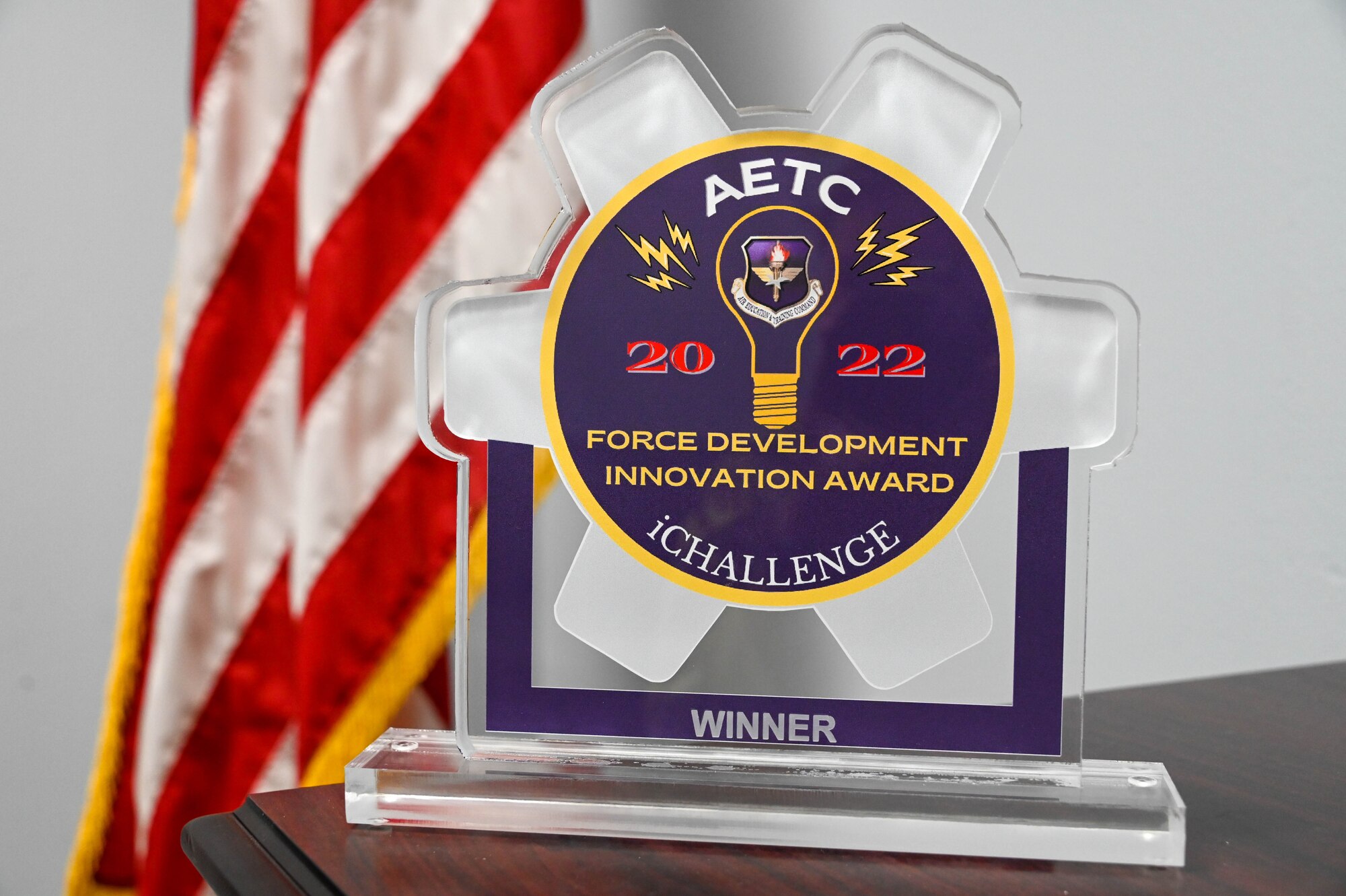 The 2022 Air Education and Training Command iChallenge award is displayed at Altus Air Force Base, Oklahoma, June 13, 2022. There were three prizes at the event: a first place award with the grand prize of $225,000 and the other two with $125,000 towards their innovation projects. (U.S. Air Force photo by Senior Airman Kayla Christenson)