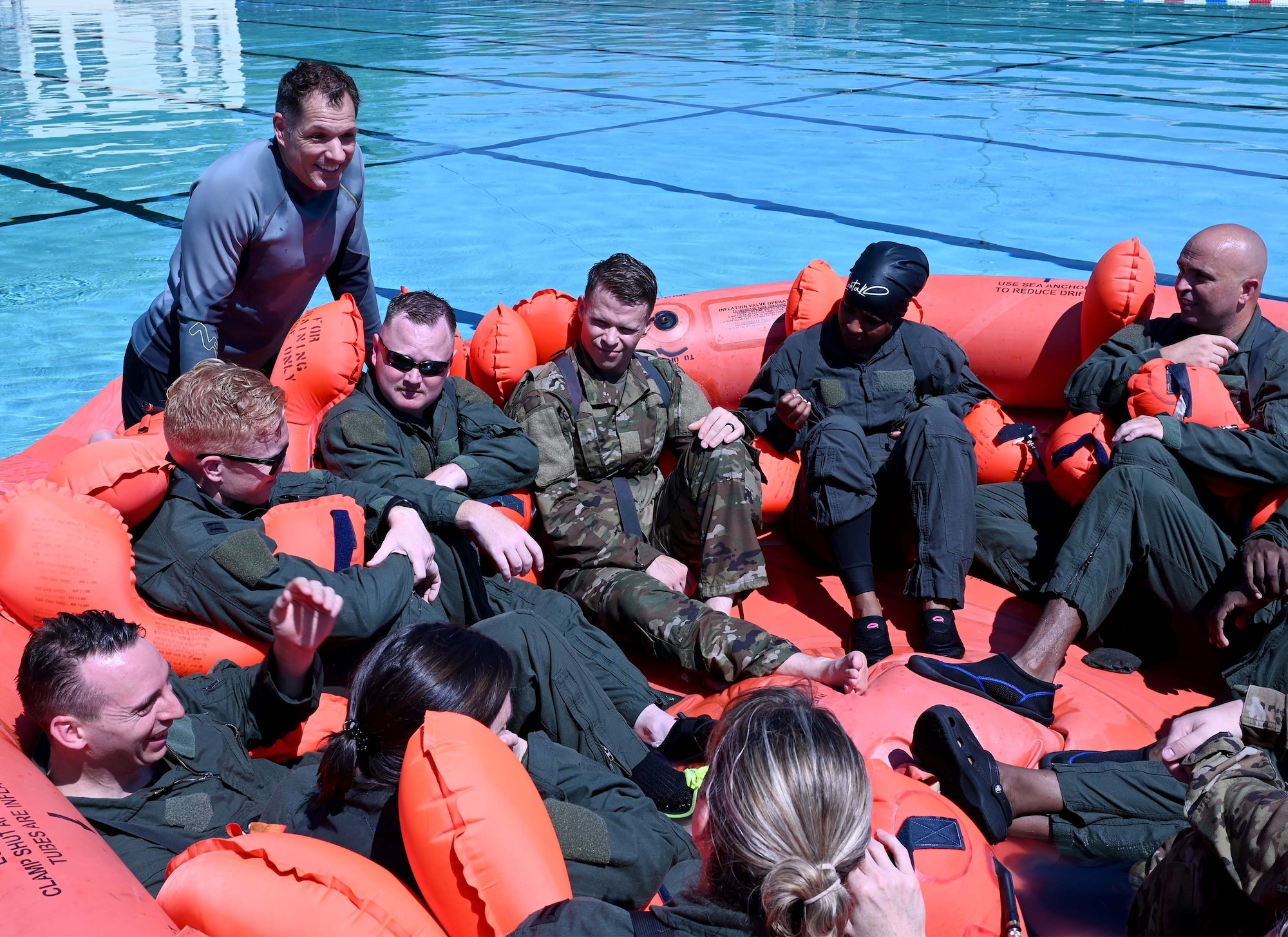 members sit in a flotation device