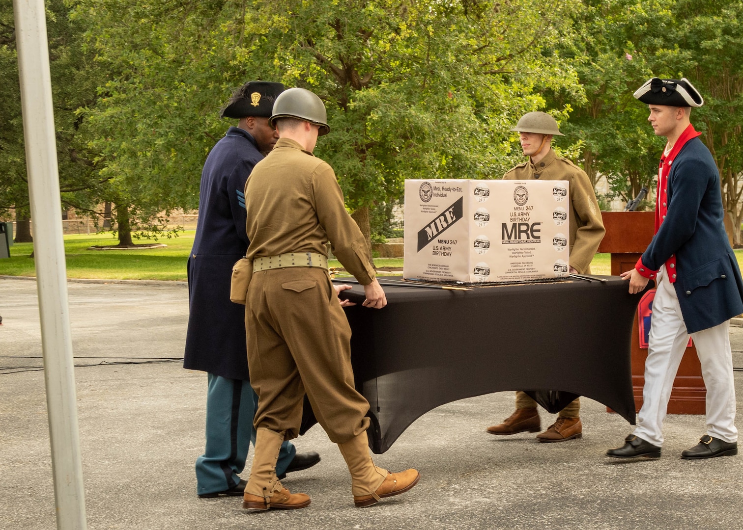 U.S. Army Soldiers carry the birthday cake for the ceremonial cutting during the Army’s 247th birthday celebration, held at Joint Base San Antonio-Fort Sam Houston, Texas, June 14, 2022. The Army’s annual birthday celebration highlights total force history and tradition, and commemorates the continuous commitment to defending America 24/7. (U.S. Army Photo by Spc. Andrea Kent)