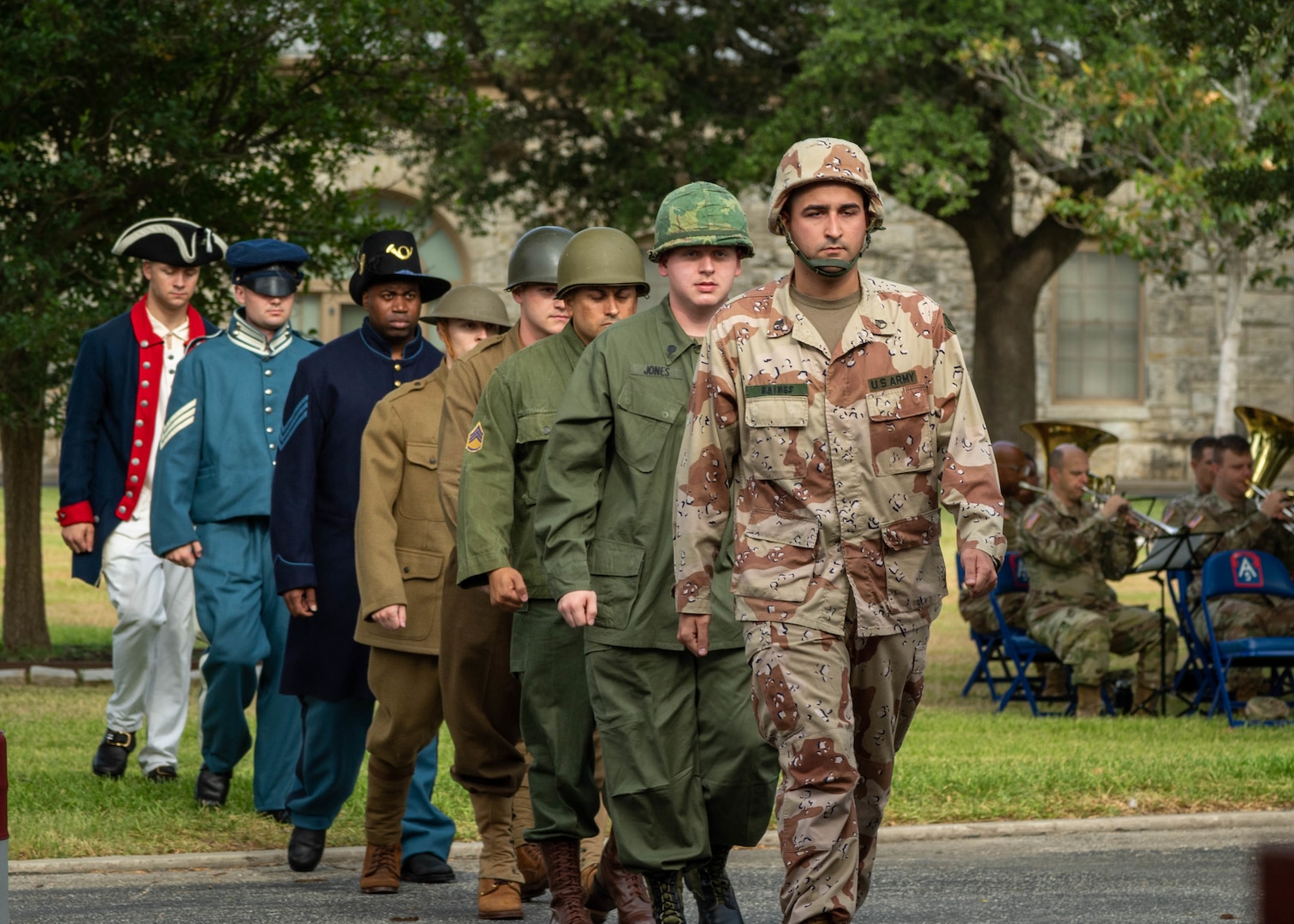 U.S. Army Soldiers dressed in past Army military uniforms walk to the front for a demonstration during the Army’s 247th birthday celebration, held at Joint Base San Antonio-Fort Sam Houston, Texas, June 14, 2022. The Army’s annual birthday celebration highlights total force history and tradition, and commemorates the continuous commitment to defending America 24/7. (U.S. Army Photo by Spc. Andrea Kent)