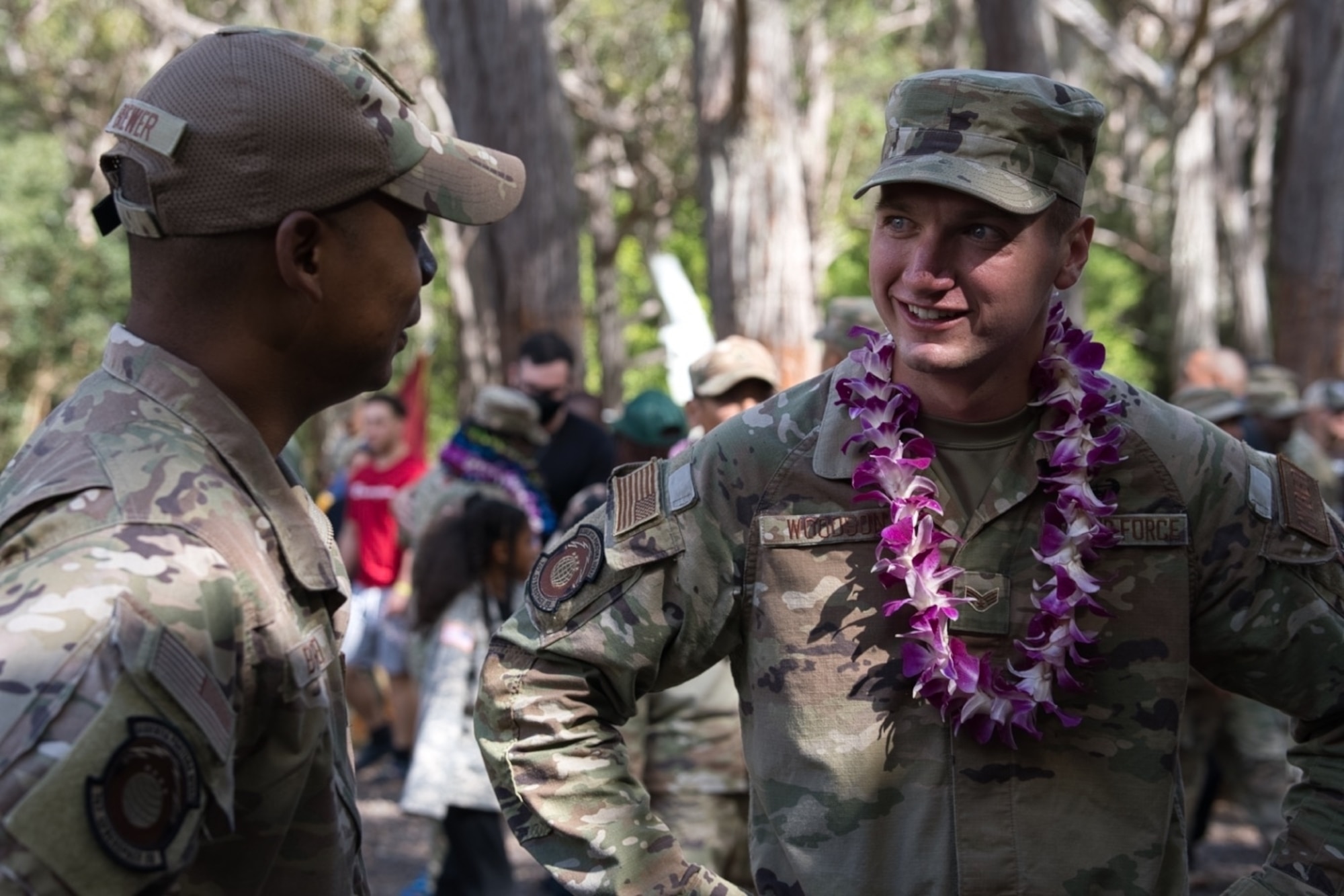 Lt. Col. Michael Brewer, 747th Cyberspace Squadron commander, congratulates Senior Airman Caden Woodson, 747th CS front-end software developer, on earning the Air Assault Badge after graduating Army Air Assault School at Lightning Academy, Hawaii, April 15, 2022.  During this 10-day course, students are trained for insertions, evacuation and pathfinder missions, focusing on mastering rappelling techniques from rotary-wing aircraft.  (Courtesy Photo)