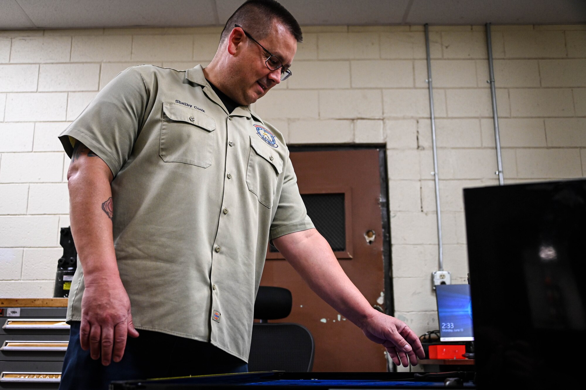 Shelby Cook, 97th Maintenance Squadron shift supervisor, grabs a tool from a toolbox at Altus Air Force Base, Oklahoma, June 13, 2022. Each tool is accounted for after an aircraft maintainer checks the toolbox out and, if one is lost, every available maintainer must look for it during their shift. (U.S. Air Force photo by Senior Airman Kayla Christenson)