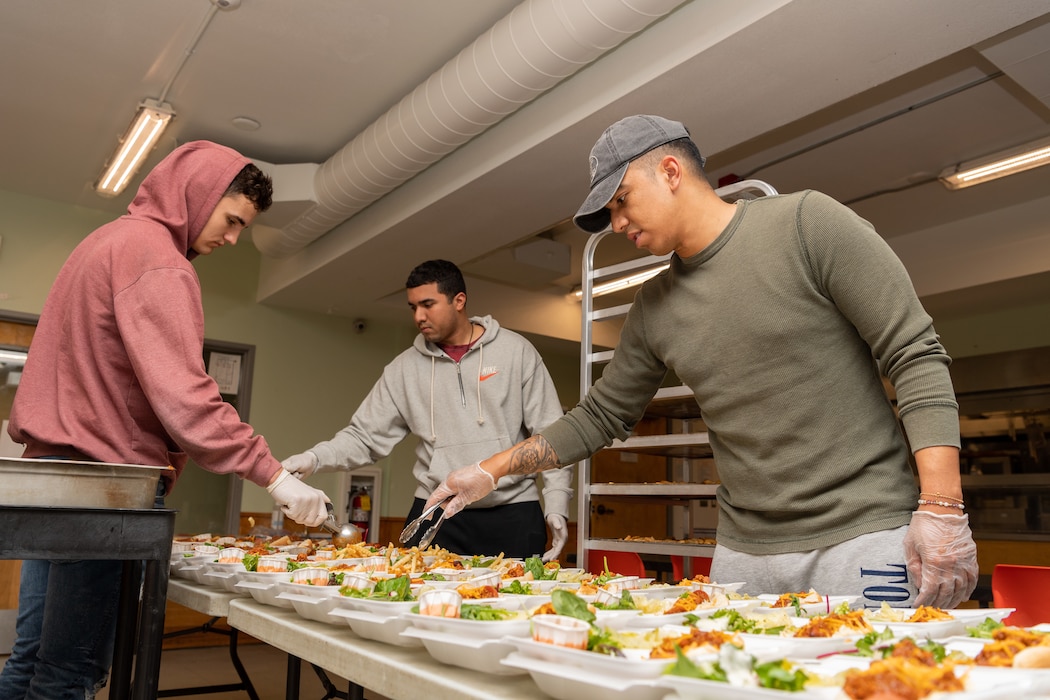 Sailors assigned to the Zumwalt-class destroyer USS Michael Monsoor (DDG 1001), prepare meals for the local homeless community at the Share House in Vancouver, Washington during Portland Fleet Week, June 12, 2022.