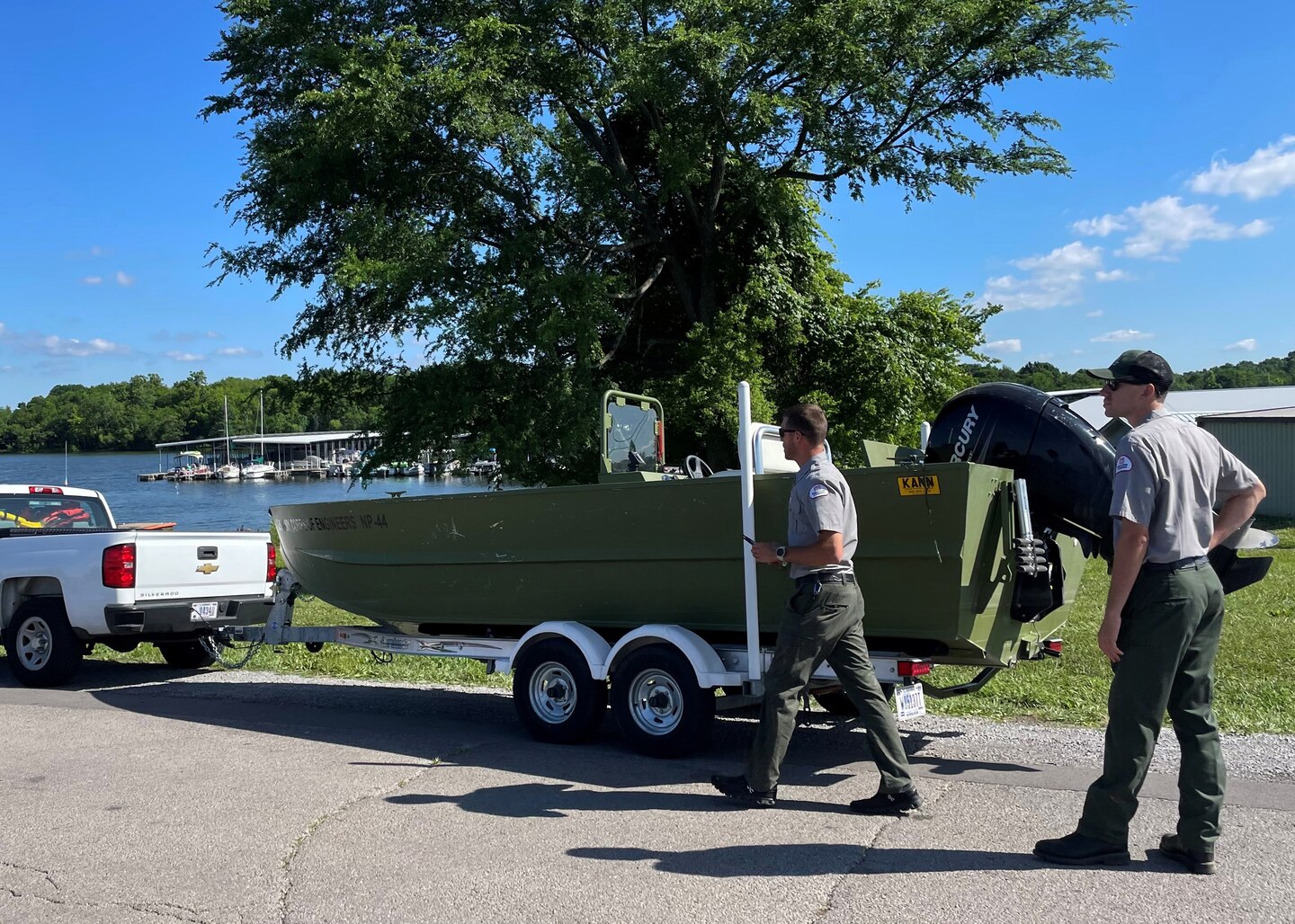 J. Percy Priest Lake rangers Cole Johnson and Andrew Harrell prepare their boat for the massive casualty triage and evacuation training exercise at Fate Sanders Marina on J. Percy Priest Lake in Smyrna, Tennessee, June 9, 2022. Rangers passed out life jackets and helped maintain a safe waterway during the exercise event. (USACE Photo by Misty Cunningham)