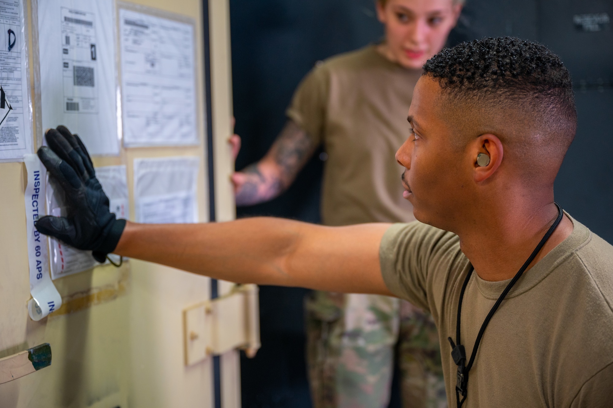 Staff Sgt. Anthony Johnson checks a pallet’s inventory