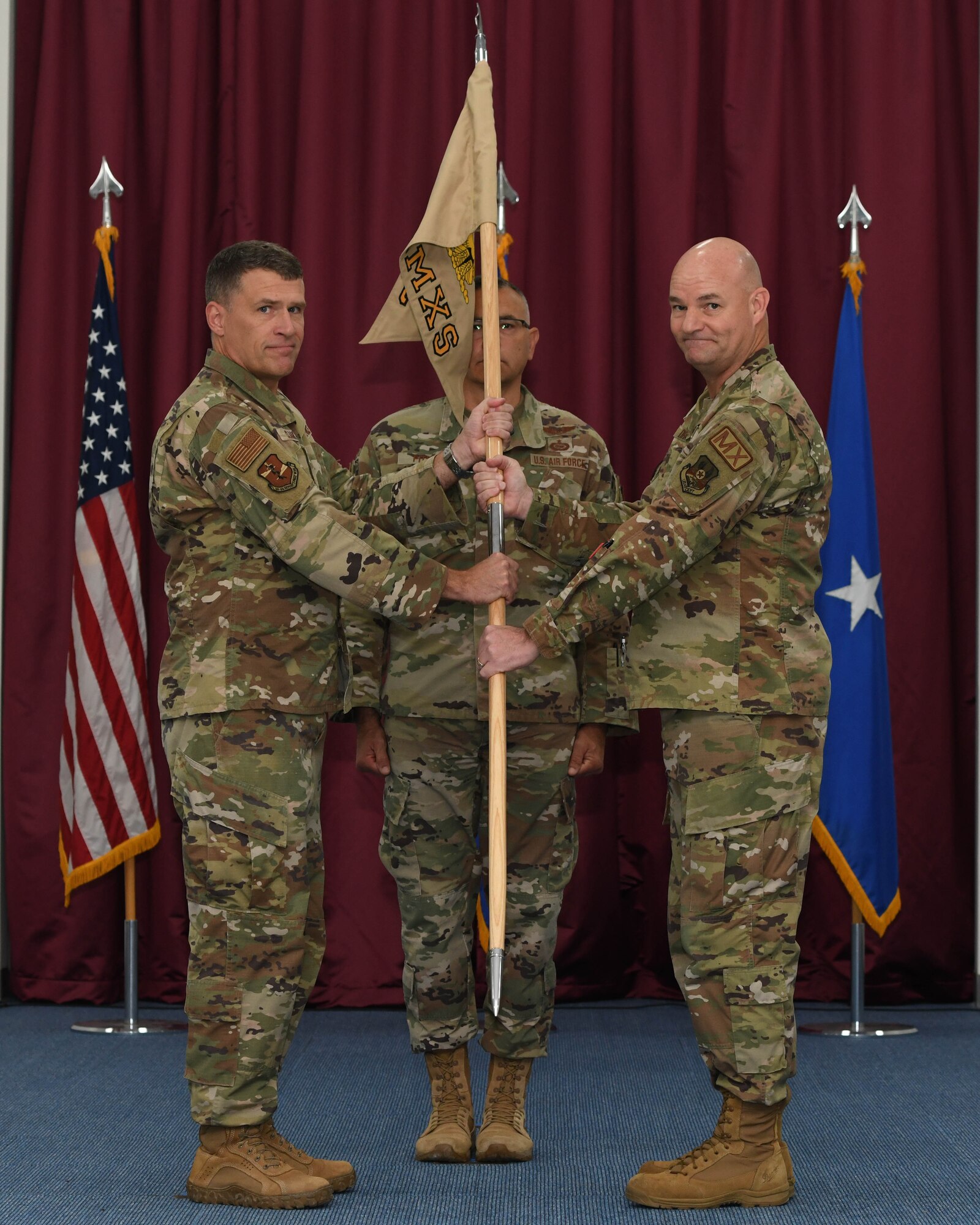 Maj. Steven M. Draughon, the new commander of the 380th Expeditionary Maintenance Squadron, is congratulated by Brig. Gen. Andy Clark, commander of the 380th Air Expeditionary Wing, after a change of command ceremony June 2, 2022 at Al Dhafra Air Base, United Arab Emirates. Prior to his new assignment, Draughon was the Aircraft Maintenance Assignments Team Chief, Air Force Personnel Center, Joint Base San Antonio, Texas.