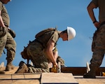 Pfc. John Beckman, a carpentry and masonry specialist with the 2120th Engineer Company, participates in the Cherokee Nation Civil Engineering Innovative Readiness Training June 9, 2022, in Tahlequah, Oklahoma. Air and Army National Guard members work in two-week rotations from April to August, building seven homes each year for low-income or homeless military veterans of Cherokee Nation.