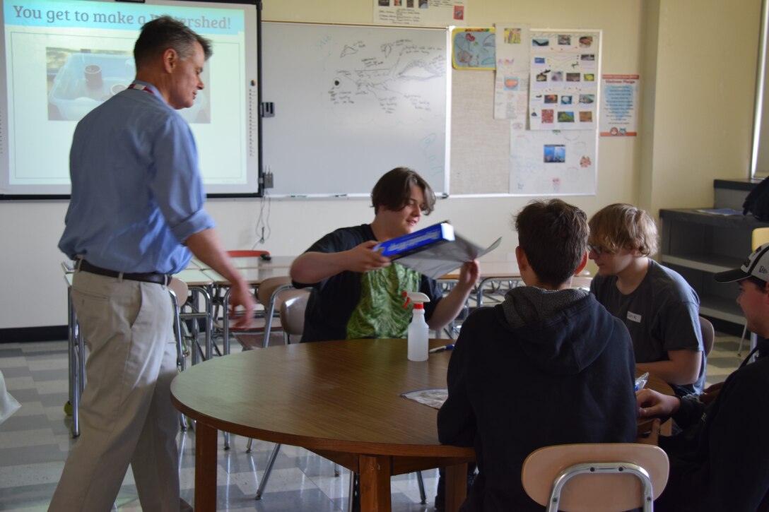 U.S. Army Corps of Engineers, Buffalo District Leadership Development Program I participants perform a hands-on demonstration to educate local high school students about watersheds and how Corps of Engineers' careers and projects can play a role in watersheds, May 11, 2022.