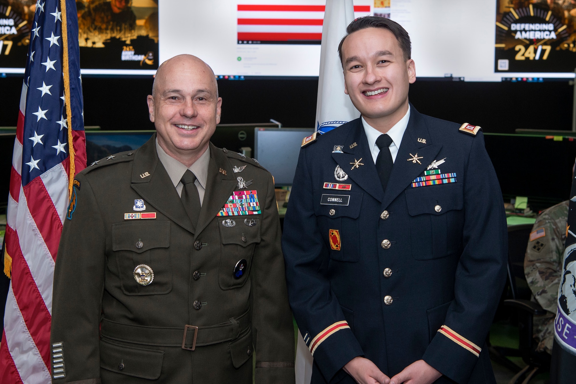 two men in military uniforms smiling