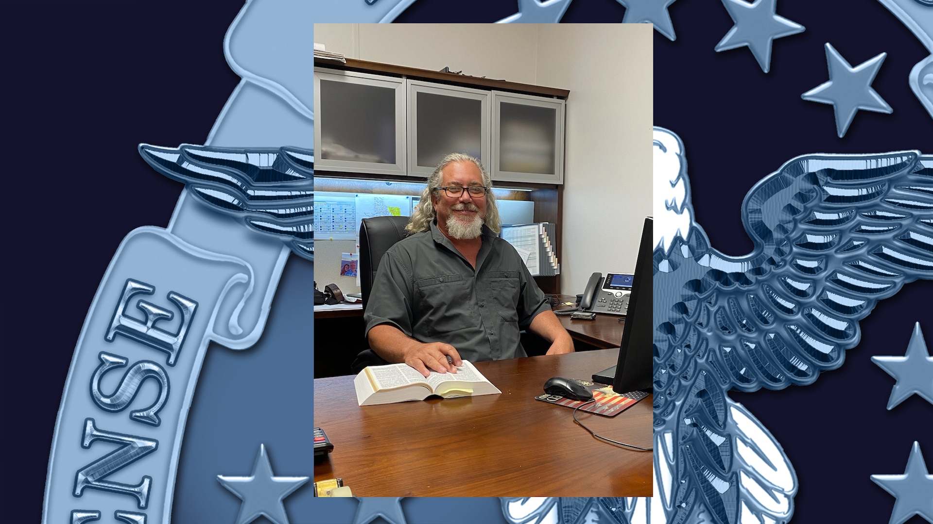 DLA Disposition Services' Environmental Specialist Kevin Sparks at his desk at the Red River Army Depot, Texarkana, TX.