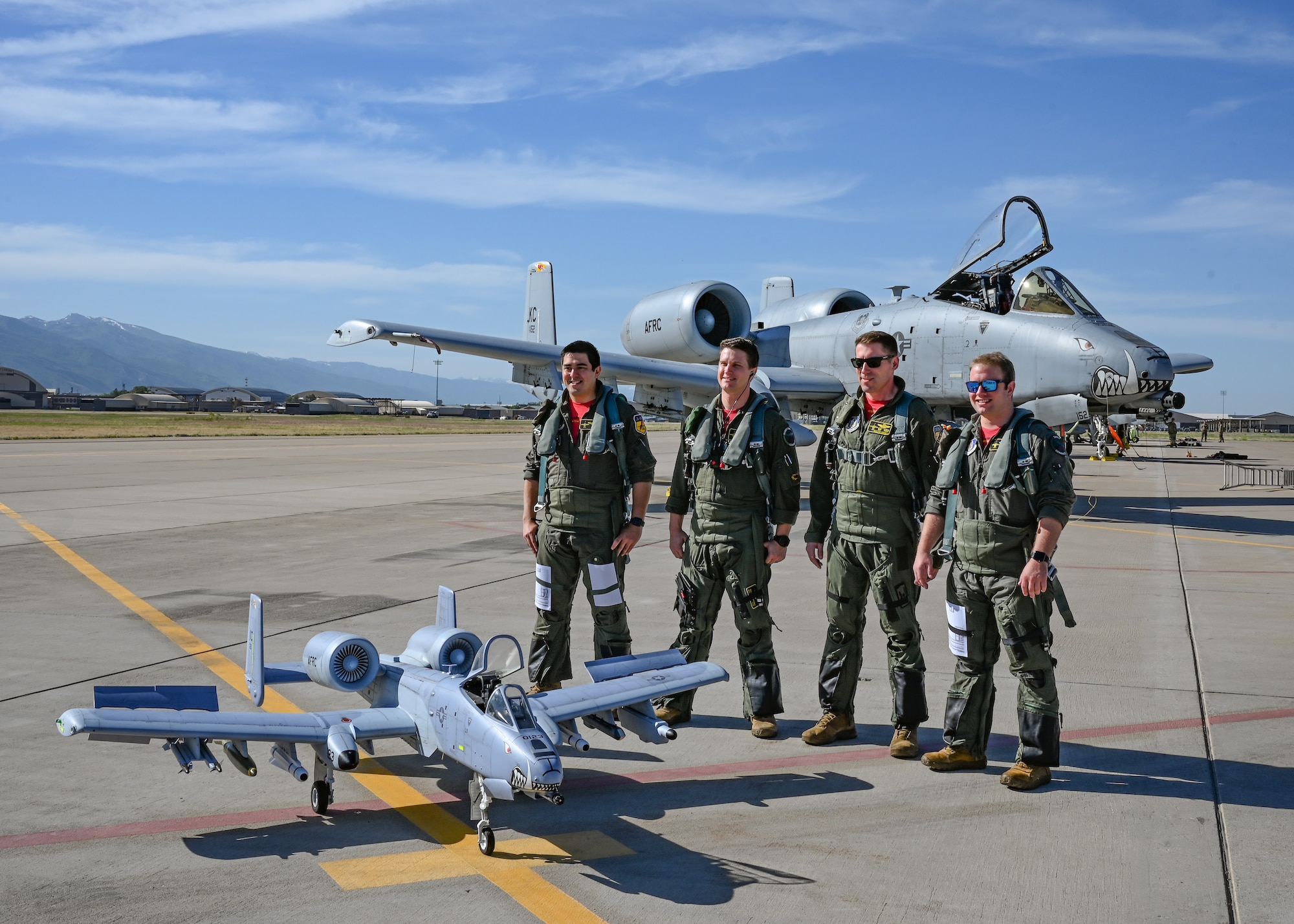 Pilots with the 303d Fighter Squadron are photographed with a remote controlled A-10 Thunderbolt II at Hill Air Force Base, Utah, June 10, 2022. The RC plane, valued at $18,000, requires a turbine engine certificate to fly. (U.S. Air Force photo by Tech. Sgt. Missy Sterling)