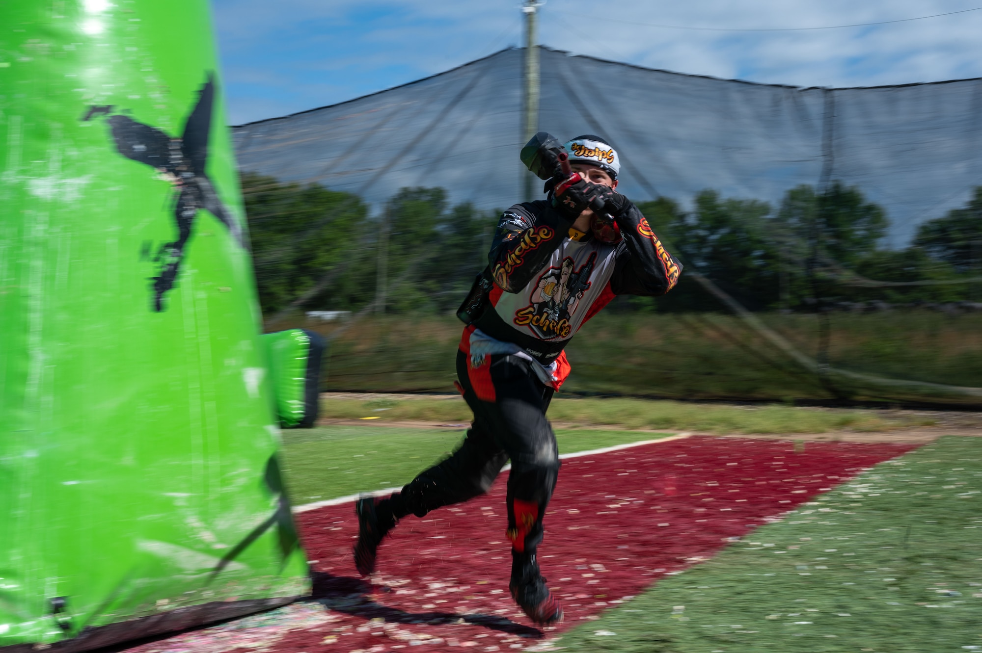 Airman 1st Class Caleb Porterfield, 736th Aircraft Maintenance C-17 Globemaster II crew chief, sprints between barriers at a paintball field in Chesapeake City, Maryland, May 29, 2022. Porterfield competes on a Division 5 speedball team and plays the sport to stay physically active and find his “inner peace.” (U.S. Air Force photo by Airman 1st Class Cydney Lee)